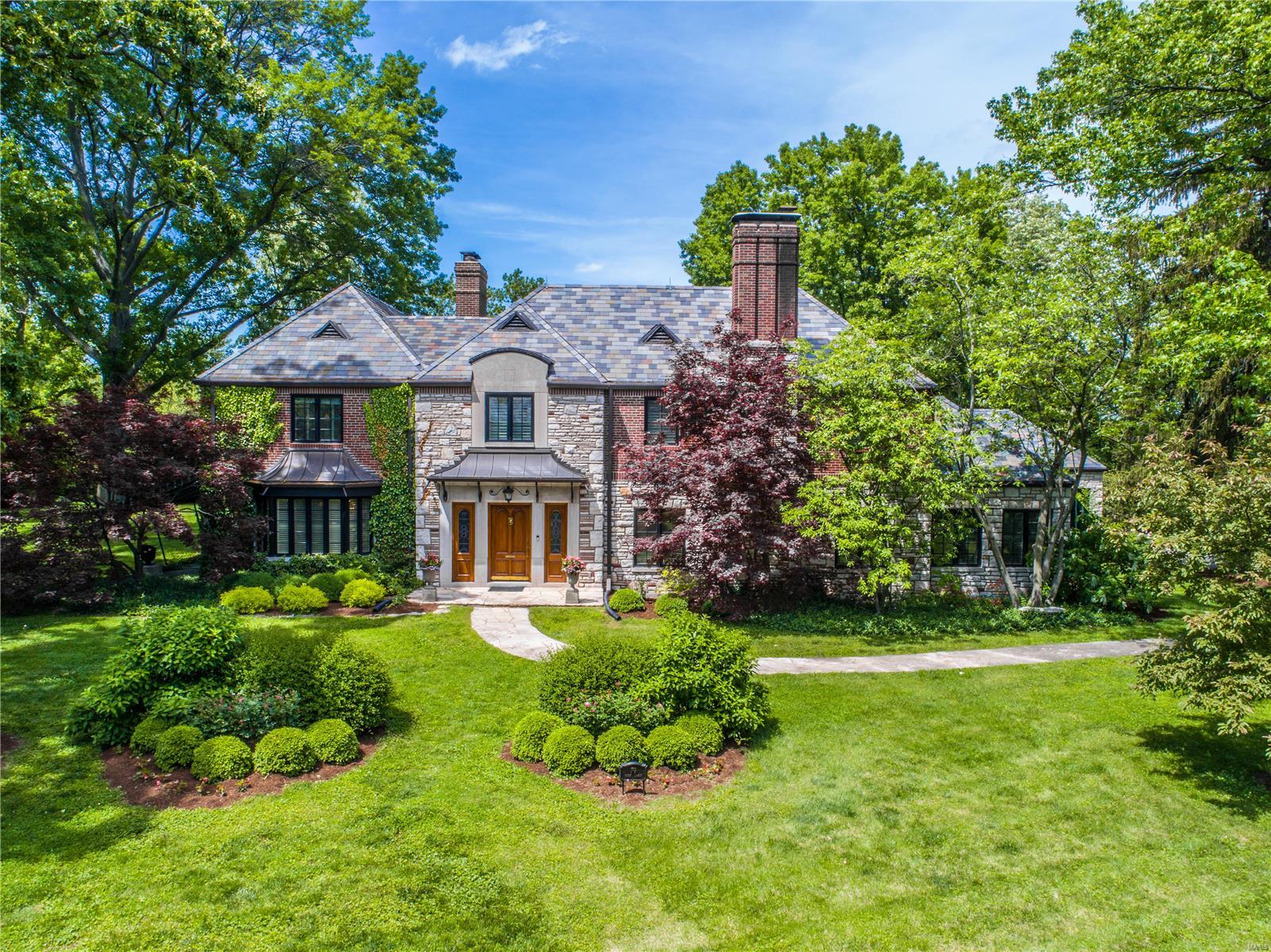 One-of-a-kind architectural gem in York Village! This breathtaking home situated on a picturesque approx 2 acres embodies the classic features of timeless architecture complemented by modern updates throughout. Striking entry foyer w/curved staircase, elegant living rm & gracious dining rm are perfect for entertaining.  A private main floor master suite oasis seamlessly added in '07 features a sitting rm, luxury bath, huge custom closet & laundry. Gourmet kitchen/breakfast rm w/custom cabinets, granite counters, w/in pantry & built-in beverage center adjoins the sunroom. A cozy library w/fireplace & guest bath complete the main floor. Upstairs find 3 add bedrooms, all w/updated en-suite bathrooms in '17 The w/o ll features a family rm, wet bar & updated bath.  Above the 3 car garage find a separate apartment w/bedroom, office & kitchen. Elevator, gorgeous terrazzo floors, 4 fireplaces, newer windows, slate roof & copper gutters in '09, updated electric & plumbing - the list is endless! Additional Rooms: Sun Room