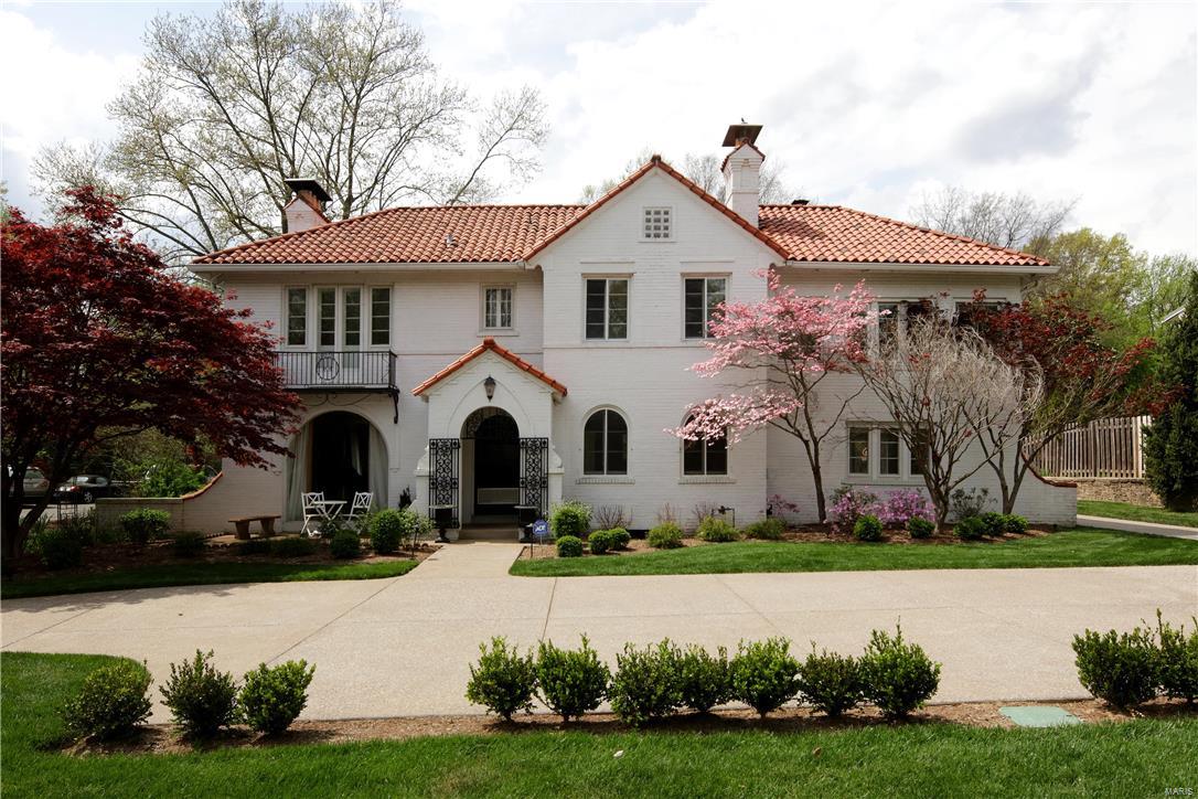 This fabulous home in Spanish style architecture features 5 bedrooms and 3 and a half baths. The center hall floor plan is open, light and bright. The step down living room features an oversized stone fireplace, large picture window and terrazzo marble floors. In addition you'll find a formal dining room, breakfast room off the kitchen and spacious family room with additional fireplace. Upstairs you will find the master bedroom with a large walk in closet and recently renovated master bath. 4 other bedrooms and 2 additional baths complete the second floor living area.  A renovated basement, with wet bar, offers additional living space on the lower level.  The current owners have installed a new circular concrete driveway in the front as well as expanding the back parking pad. The new outdoor patio space with pergola, built in grill and fire pit is the perfect place to escape! With one of the larger yards in the neighborhood, you have one the finest homes this neighborhood has to offer!