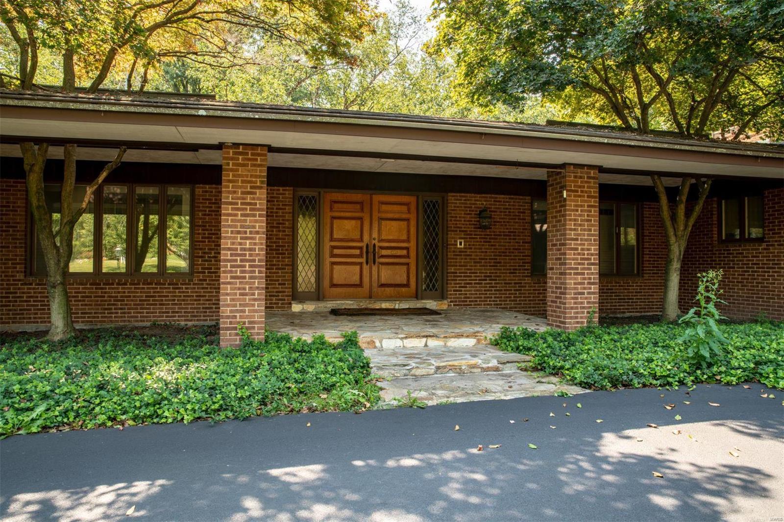 This is a wonderful opportunity to own a home on one of the most desirable lanes in Ladue.  Sprawling ranch situated on a beautifully landscaped 1.8 acre lot backing to trees provides an abundance of privacy.  Spacious rooms.  Great open floor plan.  Kitchen features a center island with skylights above. Lovely hardwood floors and mouldings.  First floor den could be used as a fourth bedroom.  Freshly painted interior. Rec room in lower level walks out to large patio.  Huge first floor utility room.  Two fireplaces.  Three car garage.  Convenient location to schools, shopping and highway access.  The possibilities are endless to add your own personal touches to create this special place you call home.