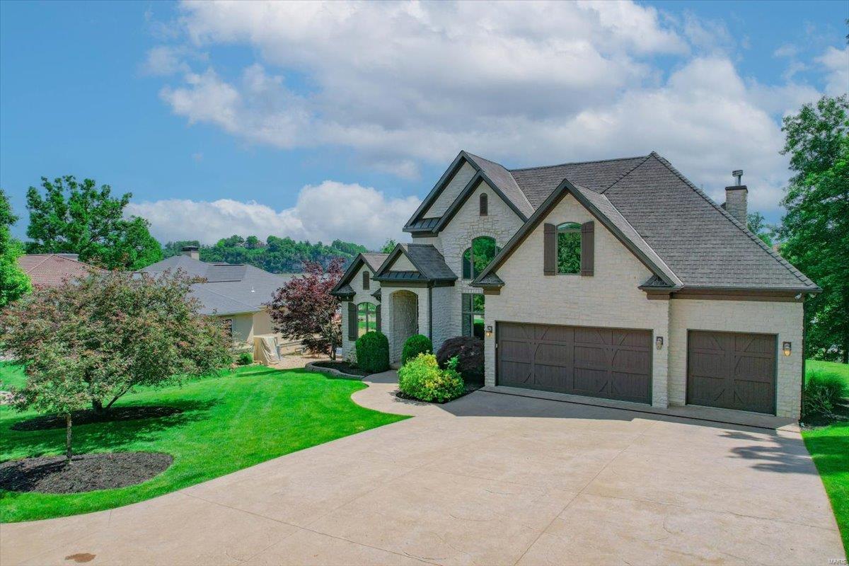 Massive 2.5 Story Lakefront Home boasting 6 bedroom (4 ensuites), 5 full baths, 2 half baths & 4,844 finished sq ft located in La Riva Estates of Port Cima! Just minutes from the best restaurants, shopping & entertainment. Features of this home include: Full Stone Exterior, FLAT Driveway, 3 Car Garage, Stamped Concrete, 3 Gas Fireplaces, Walk-in Closets, Main Level Tiled Deck, Fenced Back Lawn, Chef’s Dream Kitchen, Formal Dining, High Ceilings, Bunk Room, 2 Living Rooms, Theater Room, Laundry on Main & Lower Level, Wet Bar, Turn-Key, Screen-In Outdoor Kitchen, Heated Gunite Pool, Abundance of Natural Light, Main Level Living, Lake-Fed Irrigation, 2 Well Concrete Dock, Cove Location w/Main Channel Views, & Quiet Neighborhood. Updates include: 2 New Heat Pump HVACs, 2 New 50-gallon Water Heaters, Sonos Surround Sound, & Top of the line Security System. Comes w/ a 1-year Achosa Home Warranty. This Home is Nightly Rental Allowed w/ rentals on the books that can be transferred!