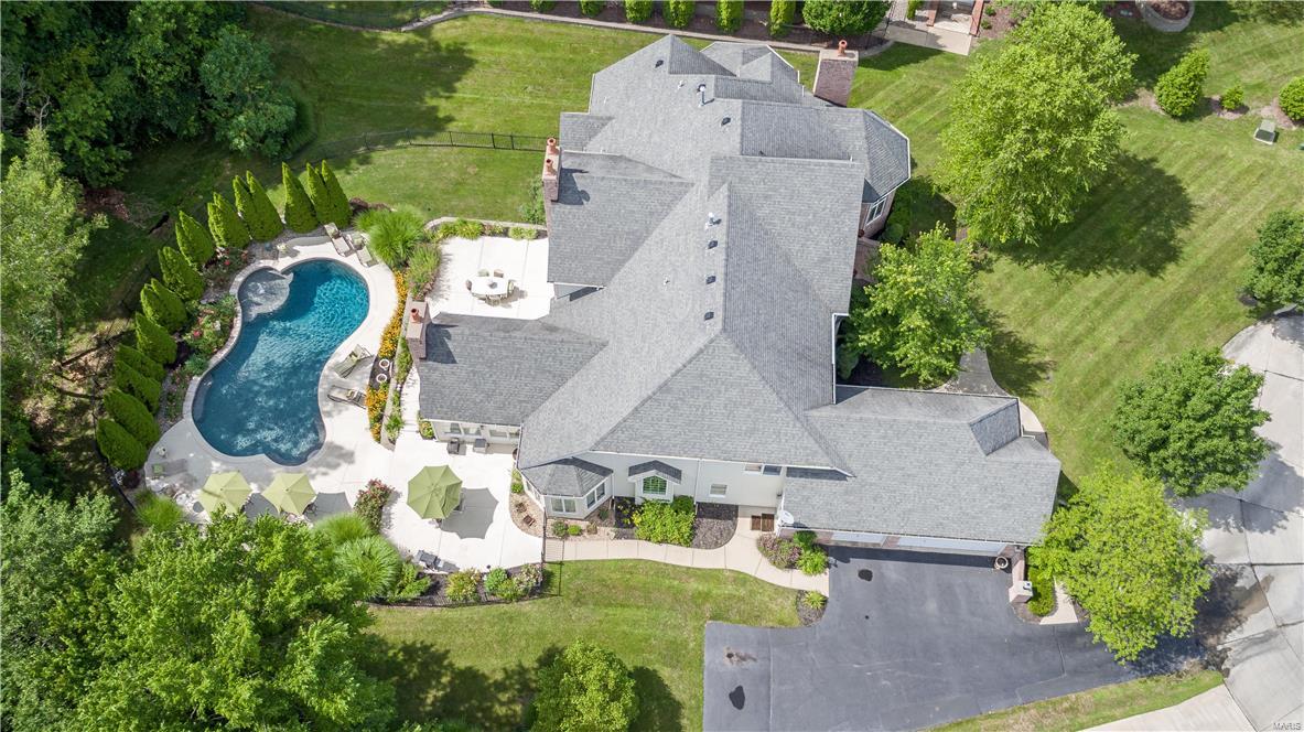 IGNORE DAYS ON MARKET, THIS HOME IS AMAZING! Wallpaper is being removed in all areas, house will be freshly painted through out. Stunning 1.5 story custom built home on a private, quiet cul-de-sac lot, approx. an acre of land, 2 full brick chimneys on exterior to add to the grandeur of this home. Perfect design on the in-ground pool & backyard w/ 3 patio areas. Grand entrance to your front door w/ brick steps leading you into your 2 story entry w/ marble floors, private study w/ wood floors & fireplace. Grand formal dining room w/  bay windows & wood floors, 2 story great room w/ fireplace, walls of windows over looking the pool. The kitchen is perfect for a family, huge & open w/ custom cabinetry, granite counter tops, upgraded appliances & soaring vaulted ceilings t/o the breakfast room & hearth room w/ a cozy fireplace. ML master suite w/ sitting room & huge luxury bath. Upstairs 3 large bedrooms, Jack & Jill bath & a private bath, open spindled staircase to stunning views below.