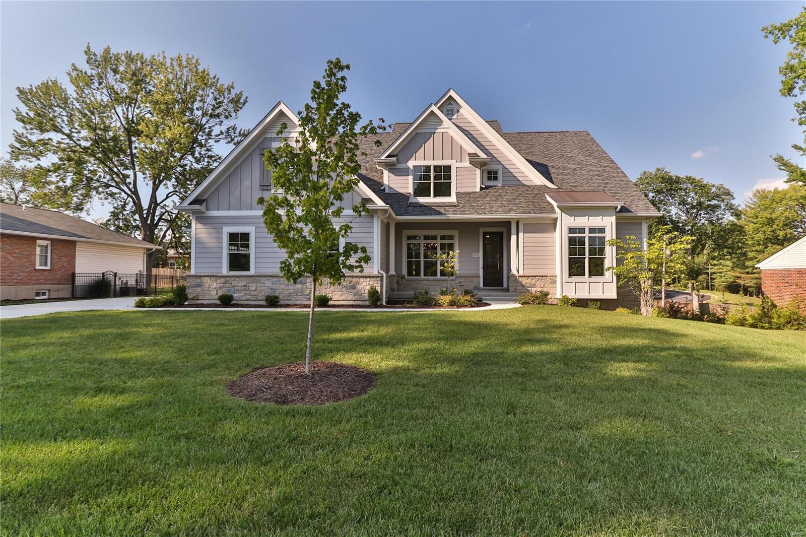 High quality custom home construction in move in ready condition. First floor highlights:10' ceilings, 8' doors, stained oak staircase, tray ceilings, beamed ceiling, wainscoting, and ship lap accent walls. The kitchen features include custom shaker style cabinetry, quartz countertops, a prep sink and a 36" professional gas range. The first floor master bedroom suite includes a window seat, Carrara marble bathroom, and a custom closet. The second floor includes oak hall flooring, a family workstation, 3 large bedrooms with custom closets, and a bonus room for the kids. Exterior materials include James Hardie Colorplus siding and Pella clad wood windows and doors. Timeless finishes, designer lighting, and energy efficient upgrades round out this home. Convenient Des Peres location steps from St. Clement Parish and close to parks and shopping.