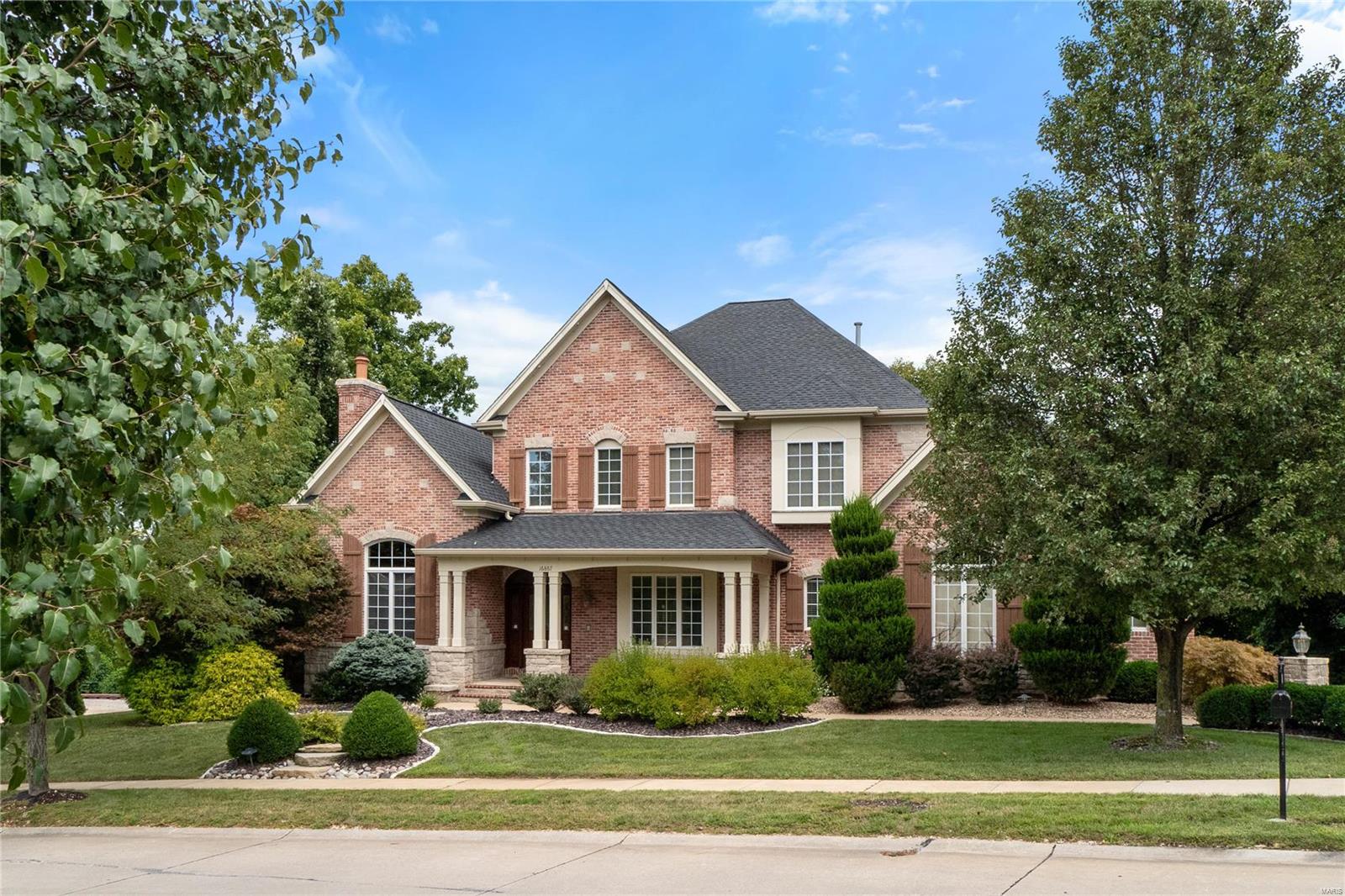 Stunning 1.5 story with amazing architectural details. Arched doorways & openings, transom windows, custom built-ins, exquisite millwork. Maple floor thruout the main living areas. Study with arched transom & fabulous custom stone and brick fireplace. Formal Dining rm w/box bay window, crown molding. Great rm has box bay window, crown molding & see thru fireplace with custom mantle. Huge 2 story hearth rm with custom built-ins & wall of windows overlooking fabulous pool & wooded yard. Chef's kitchen with granite, stainless appliances; custom cabinets w/crown molding, 42" wall cabinets (some glass fronts), custom backsplash, walk-in pantry, butler's pantry, coffered ceiling, gas cooktop. Breakfast rm w/custom built-ins & atrium door to deck. Huge laundry w/built-in cubbies. Main level master w/newer carpet, coffered ceiling, 2 walk-in closets and luxury bath. Incredible lower level w/huge family rm, bar, bedroom, bath & multi-purpose rm. Jaw-dropping pool, hot tub, patio, deck & yard!