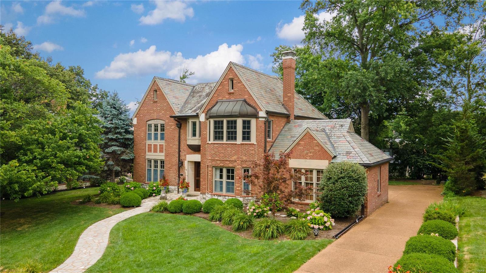 Located in the prestigious Lake Forest subdivision & the highly rated Clayton School District, this exquisite residence epitomizes luxury living. Boasting exceptional curb appeal, this home showcases high-end finishes & updates throughout. The expansive living room & sunroom open onto an outdoor deck which is perfect for relaxation & entertaining overlooking a backyard with ample space for outdoor activities. The gourmet kitchen is a masterpiece with top-tier appliances & custom cabinetry. The main floor features a sophisticated office adjacent to an updated half-bath. Upstairs, the indulgent primary suite awaits, offering a spacious retreat with a beautifully renovated bath, sitting room, & ample closet space. Three additional bedrooms on this level share a well-appointed full bath. The lower level is designed for recreation, featuring a media room, half-bath & workshop/storage room. This property represents a rare opportunity to experience the pinnacle of luxury living in Lake Forest Additional Rooms: Sun Room