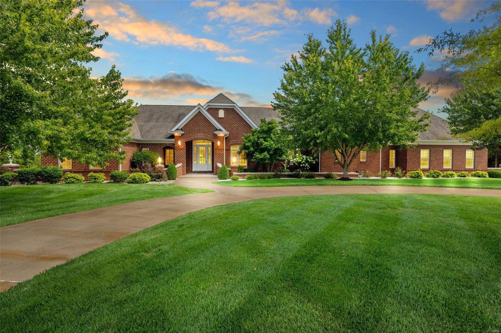 Welcome to your sprawling French Chateau. This stately brick structure spans 130 feet with the Main Level of 4579 sq ft, and a Terrace Level of 3000 sq ft. A 5-Car 88 foot Attached Garage spans from 26 to 39 feet deep. A multi-generational residence of refined finishes and privacy for long term guests. Wide gallery spaces transition among the wings of the home providing complete stairless access aiding anyone with mobility challenges. The 2022 Kitchen offers a soaring windowed cupola that is the star of this home. While finishes are grand, the design is for comfort, from intimate dinners to a casual entertaining for a crowd flowing from poolside to fireside. Tour begins at the Main House, Private Shared Stocked Lake, and the finale is the 4000 sq ft heated "Dream Shop" with full bath ready for your car collection, business equipment, man cave, or ninja training. A mature treescape screens the Shop and Vast Parking from the Main House. Professional Photos and Captions are coming soon. Some Accessible Features Additional Rooms: Mud Room, Wine Cellar COOL: 14 SEER+