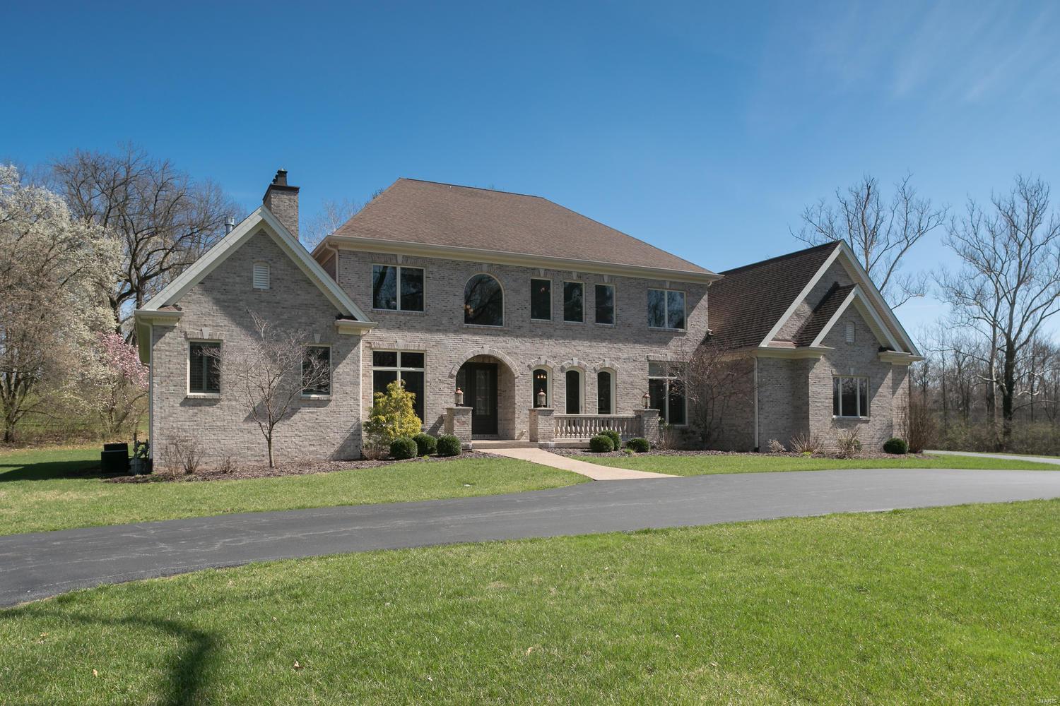 Live where you love, love where you live situated on a manicured 2.9 acres tucked away at the end of a coveted tree-lined private lane centrally located in the heart of Ladue! This is a rare opportunity to own a stunning 12 yr old 5 bed 7 bath Bob Berkley built appointed with all the amenities in a thoughtfully designed sophisticated home. The Great Room overlooking the grounds greets you as you enter the home. Recently painted, updated and enhanced by the seller in calming gray tones, pristine hardwood floors thru-out, and a smartly redesigned sleek chef's kitchen w/SS appliances, 3 dishwashers, new center island, dining banquette, stone countertops, backsplash, pot filler, and wet bar add a contemporary flavor. The adjacent comfortable family room overlooks the grounds & additional outdoor living area w/ fireplace, hot tub and saltwater pool. The lower level completes this oasis with media room, comfy leather chairs, an exercise room, a full bath and a recreation room with wet bar. Additional Rooms: Mud Room