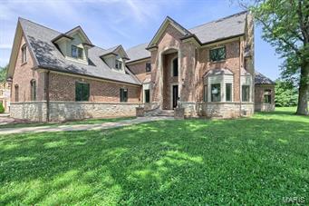 Beautiful home boasting neutral decor is perfect for today's luxury buyer!  Almost 9,000 SQFT of total living space offers a spacious floor plan, 5 bedrooms, 6 bathrooms, a luxury kitchen, full finished basement and many more amazing features. The attention to detail is apparent with the custom mill-work and trim, beautiful 7" hardwood floors and custom cabinetry throughout.  The family room features a custom floor to ceiling fireplace.  The 1st floor master suite has a luxury bath, wet bar and large walk in custom closet.  The eat-in, gourmet kitchen displays stunning cabinetry and counter-tops, a large farm sink, and high-end appliances, including a commercial refrigerator.  Upstairs boasts, 4 beds, a loft, and enormous game room with wet bar.  Lower walk out level has 3,000 sqft with a  safe room.  Buyer to choose flooring for the lower level and some key light fixtures throughout the home (items included in the price).  See attached PDF's for more luxury features and floorplan.