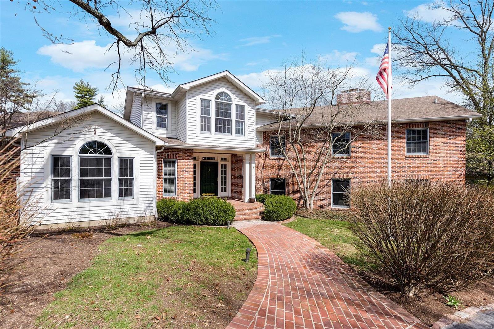 Nestled on one of Ladue's most prestigious lanes, this classic American colonial offers an unparalleled lifestyle. Open and airy entry sets the tone for this updated open floorplan with a youthful zest and flow. The vaulted ceiling family room with fireplace and wet bar is a mecca for entertaining, while formal rooms offer respite or raucous good times. Sun filled kitchen and breakfast room are the heart of the home. 1st floor master suite with sunroom is a private oasis from the living spaces, with multiple closets and massive bath. Upstairs offers remarkably spacious bedrooms and 3 full baths. In-law apartment with full bath and laundry, plus two attached 2 car garages cater to a variety of lifestyle and generational options. Spectacular resort-like setting with saltwater pool, screened gazebo, & wrap around deck. With a walk out basement rec room/gym, workshop, and 1350 bottle wine cellar – why ever bother leaving home? Exceptional opportunity awaits! *Correct address is 00 Fordyce* Additional Rooms: Sun Room