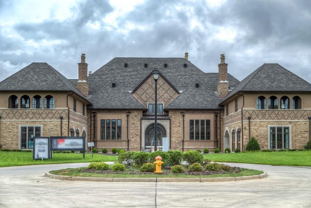 Exquisite 1.5-Sty European-styled Manse! Situated at the end of the cul-de-sac, this custom design home with its elegant circular drive makes a stunning entrance. Over 15,000 sq ft of living space enhanced by extraordinary craftsmanship, superb architectural finishes & state-of-the-art systems. The open floor plan provides room for fun & entertaining with quiet areas for relaxation. Professional quality appliances, granite countertops & custom cabinetry are featured in the exceptionally large kitchen. The adjoining breakfast room & stunning hearth room highlighted by full-height stone fireplace offer a welcoming gathering place. The master bedroom suite is a haven of luxury with coffered ceiling, His & Hers walk-in closets & beautifully appointed master bath with Jacuzzi.  Elevator access to 2nd floor living quarters with 4 additional ensuite bedrooms plus bonus loft room. Gorgeous 6+ acre grounds include deck, patio, 2 inground pools, hot tub, circular drive & 18-car spaces.