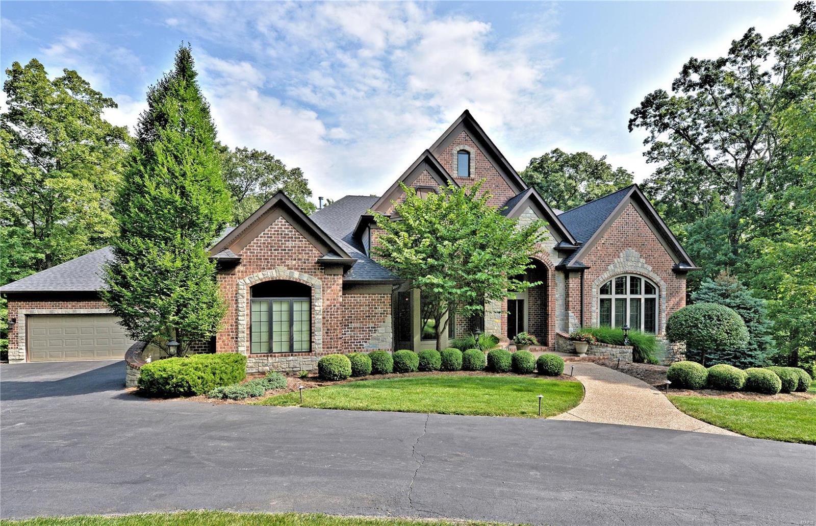 8028 sq. ft. of resounding quality, comfort & beauty awaits you in this remarkably attractive 1.5 story home. Stunning 3.15 Acres with secluded Level park-like backyard. Home sits back from the street. Outdoor covered back porch has masonry fireplace & outstanding cooking area along with the infamous Green Egg! ALL 5 bedrooms are amply sized & have their own private bathroom/walk-in closets. Arched cased doorways along with beautiful over-sized exterior brickwork/James Hardie siding/extensive millwork/deep crown molding/5"baseboards/front & rear staircases/Marvin windows make this an architectural beauty. The attention to detail is amazing. The ceilings soar throughout the house. 2 Fireplaces. Kitchen designed by Beck Allen--Chef's delight with 6 burner gas cook top, built-in convection ovens, warming drawer, tons of storage & large center island. Massive 15'x14' laundry room is a True source of pleasure! 2 CAR AUTO COURT GARAGES are XXover-sized. Outstanding Exercise & Media Rooms! A+ Some Accessible Features