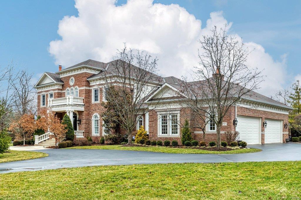 An impressive brick & limestone elevation highlights the remarkable curb appeal of this spectacular 1.5 Sty from Hayden Custom Homes. Barrel-vaulted entry foyer opens to private study with built-in bookcases, elegant dining room framed by arched entryways, stunning 2-sty great room with cast stone fireplace & dramatic wall of windows. Designer kitchen with off-white cabinetry, quartzite countertops, premium appliances & double islands adjoins breakfast room & vaulted hearth room with floor-to-ceiling stone fireplace. Spacious master bedroom suite with custom coffee bar, designer lighting & marble bath with shower spa & freestanding offers a relaxing retreat. The 2nd floor extends the living quarters with 3 additional ensuite bedrooms & bonus room. Walk-out Lower Level includes recreation room with & gathering bar, media room, game room, fitness studio plus 5th ensuite bedroom. Situated on a 1.3-ac lot with landscaped gardens, resort style pool & outdoor living area with fireplace.