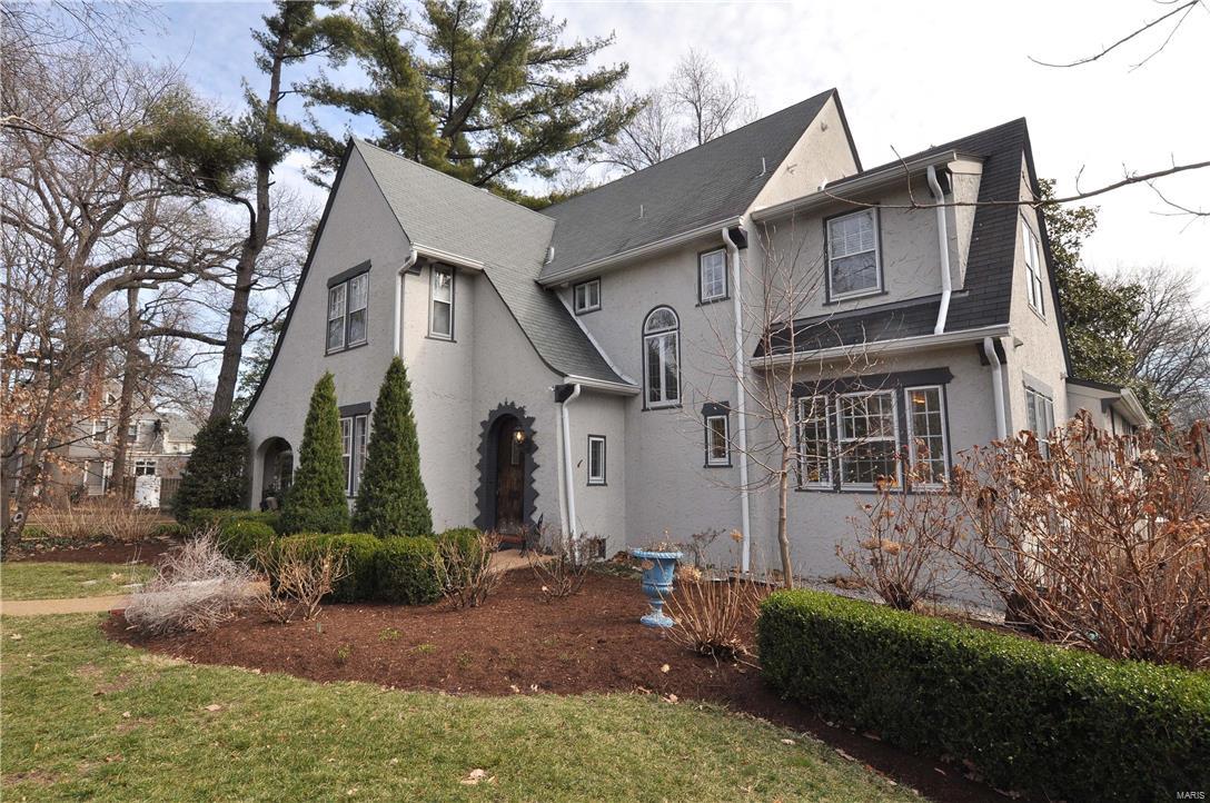 Est. 1928: Stunning English Tudor just 2 blocks to schools, dining & shopping on one of Webster's finest historic streets. 5 bedrms, 3.5 baths loaded w/ stylish updates. Great rm features gas FP, wet bar w/ wine cooler & bev. cooler. Kitchen is a cook's dream: Dacor 48" duel fuel range, Subzero fridge, 2 warming drawers, granite counters, hammered copper sinks & Boos Block island. Formal living rm w/ FP & French doors to covered side patio. 2nd flr has laundry rm; master ste w/ walk-in closet, master bath w/ large jetted tub, walk-in shower & 2 sinks; 2 additional bedrms. 3rd flr bedrm/rec rm w/ full bath & large walk-in closet. Zero maintenance, 5/4 IPE, elevated deck which flows into a deep landscaped yard. All systems fully replaced & upgraded including: electrical service w/ buried lines, zoned HVAC, upsized water service. Newer concrete driveway. Attention to detail on every upgrade blends 1928 craftsmanship, solid bones & style with modern features of newer luxury home.