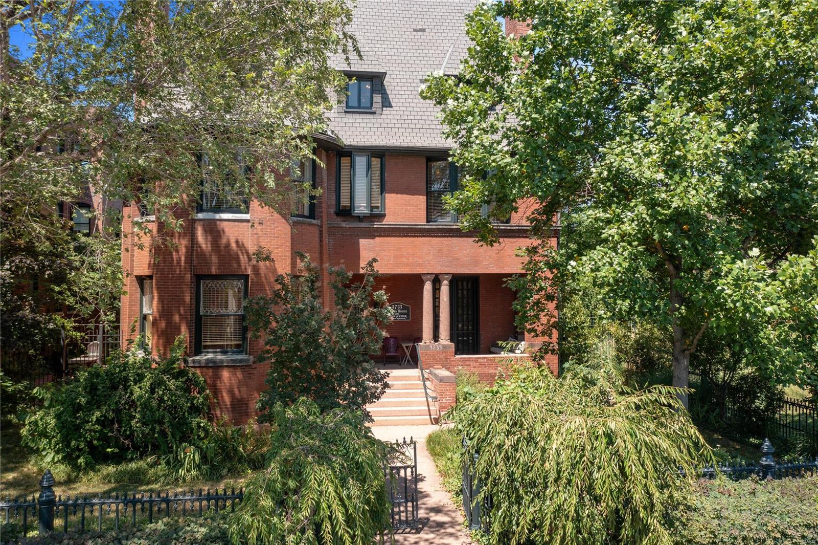Introducing the Judson House, located in the vibrant Grand Center! This historic gem, built in 1892, is listed on the National Register of Historic Places. The possibilities are endless, whether you envision it as a private residence or commercial space. This three-story, 7,300+ square foot home exudes grand historic charm with original millwork, flooring, and fireplaces. The main level boasts a spacious kitchen with butler's pantry, den, formal dining room, parlor, and living room. On the second floor, find 3 bedrooms and a primary suite featuring a massive bathroom with fireplace, dual sinks, a claw-foot tub, and huge walk-in shower. The third floor includes 2 more bedrooms, a bathroom, and a fabulous studio/rec room with vaulted ceilings. Outside, discover gardens with lush landscaping, including bountiful fruit trees, and four-car garage with a studio apartment above. Walk across the street to The Pulitzer or CAM, or stroll to see a show at The Fox, Jazz St. Louis, or the Symphony.