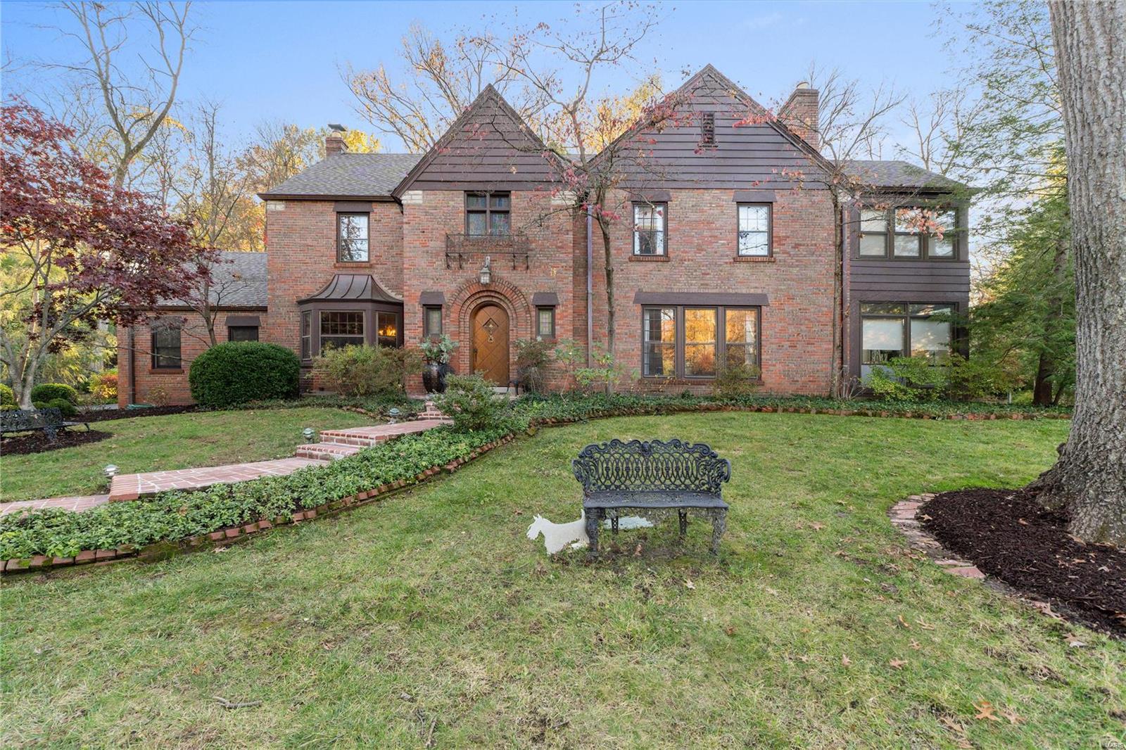 This picturesque storybook Tudor home in Ladue exudes charm with its traditional layout. It features spacious formal living and dining rooms, a large family room for entertaining, and a sun porch for lounging. The designated private office offers a quiet retreat, and beautiful hardwood floors run throughout. The four-bedroom, three-and-a-half-bathroom home includes a tastefully updated primary bathroom, complete with a Bain Ultra Thermomasseur Tub and heated floors. Outside, enjoy a private yard with a brick patio and outdoor lighting by Hanover Lighting, adding to the home’s ambiance. The three-car garage and renovation design details by the late Paul Doerner of Lawrence Group Architects make this home stand out. Located on a private cul-de-sac and just steps from Reed Elementary School, this impeccably maintained home is a true gem. Additional Rooms: Sun Room