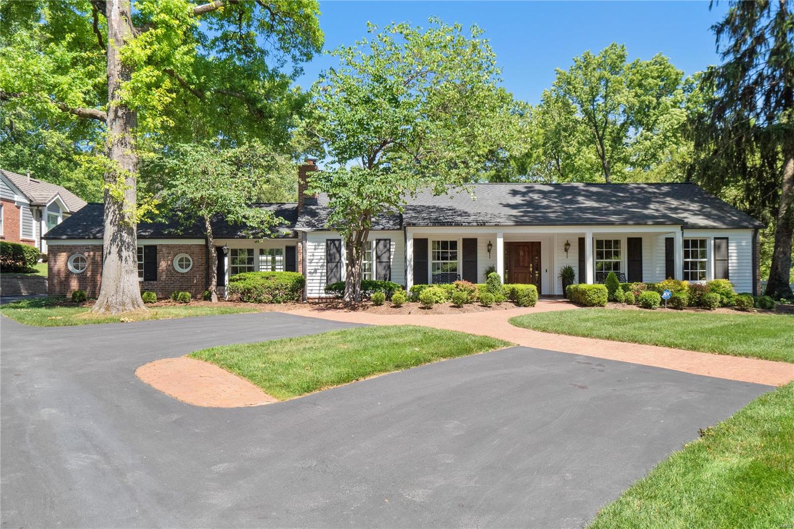 The perfect mix of fit, finish and location, this 4 bed/4+ bath Ladue ranch has it all.  Rich hardwoods and a neutral color palette make this move in ready home the perfect backdrop to live your best life.  The large LR/DR lends itself to entertaining with direct access to a chef’s kitchen with designer appliances and outdoor dining spaces.  A converted breezeway creates an informal living space, and provides access to a former garage converted to a work-out room complete with a full bathroom.  A doored study off the foyer provides privacy for a home office or can be used as a playroom, reading room, etc.  At the back of the home, the large master suite has vaulted ceilings, large closet and spa like bathroom with separate shower and soaking tub.  It also provides direct access to rear gardens and pool.  Three additional bedrooms, laundry and half bath complete the first floor.  The finished lower level provides additional flex space, arts and crafts room, storage and half bath.