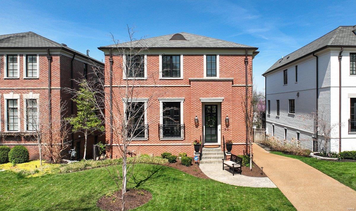 Welcome to this stunning Clayton Gardens home in the Clayton school district. Thoughtfully designed with high-end features, the main floor boasts a light filled living room, a chef's kitchen with a dining area that opens to a versatile great room, a glass-enclosed eating area & a well-appointed powder room. Upstairs, you'll find two generously sized bedrooms that share a hall bath, an en-suite bedroom, a luxurious primary suite with two walk-in closets & a spa-like bath plus a convenient laundry room. The lower level offers even more living space, a 5th bedroom with a Murphy bed, full bath, storage & access to the 2-car garage. Outside, a deck overlooks a beautifully landscaped yard & a recently added patio. Boasting a whole house generator, this home can also accommodate an elevator that could be added to serve all three levels. Situated in one of Clayton's most sought-after neighborhoods, this home offers unbeatable location with easy access to schools, shops, restaurants, and parks.