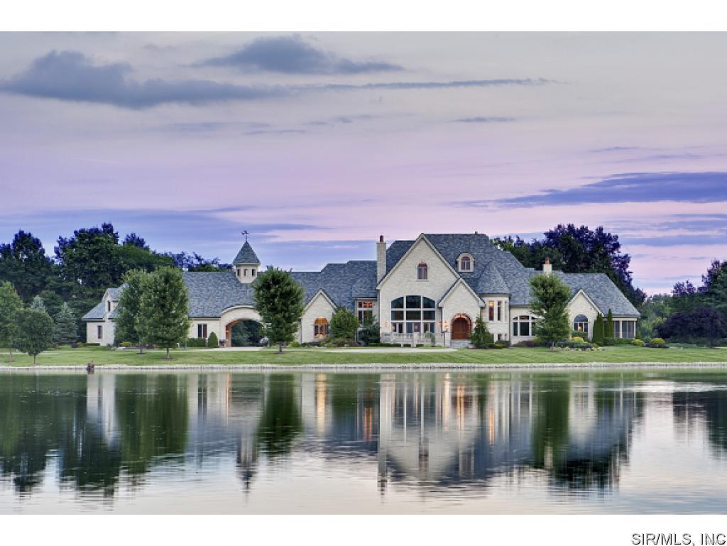 Wow, this property has been lowered over 1.4 million dollars! Welcome to Hunter's View! This 15,000 sq. ft. dream home, situated on a 35-acre estate, boasts rustic elegance through its 7 bedrooms, 11 baths, 3 kitchens and several family rooms. This custom built home was designed around the ownerâs love of the outdoors. No detail was overlooked. A wealth of wood, stone, marble, and elegant finishes complete the interior. Views of the fully stocked lake are seen from several places in the home. Outside offers a heated pool/spa, boat-lift, 72x42 outbuilding with electric and water, endless views and privacy. The list goes on and on. Every room has its own story and there is truly a legacy of family, fun and the outdoors within the walls of this home.
