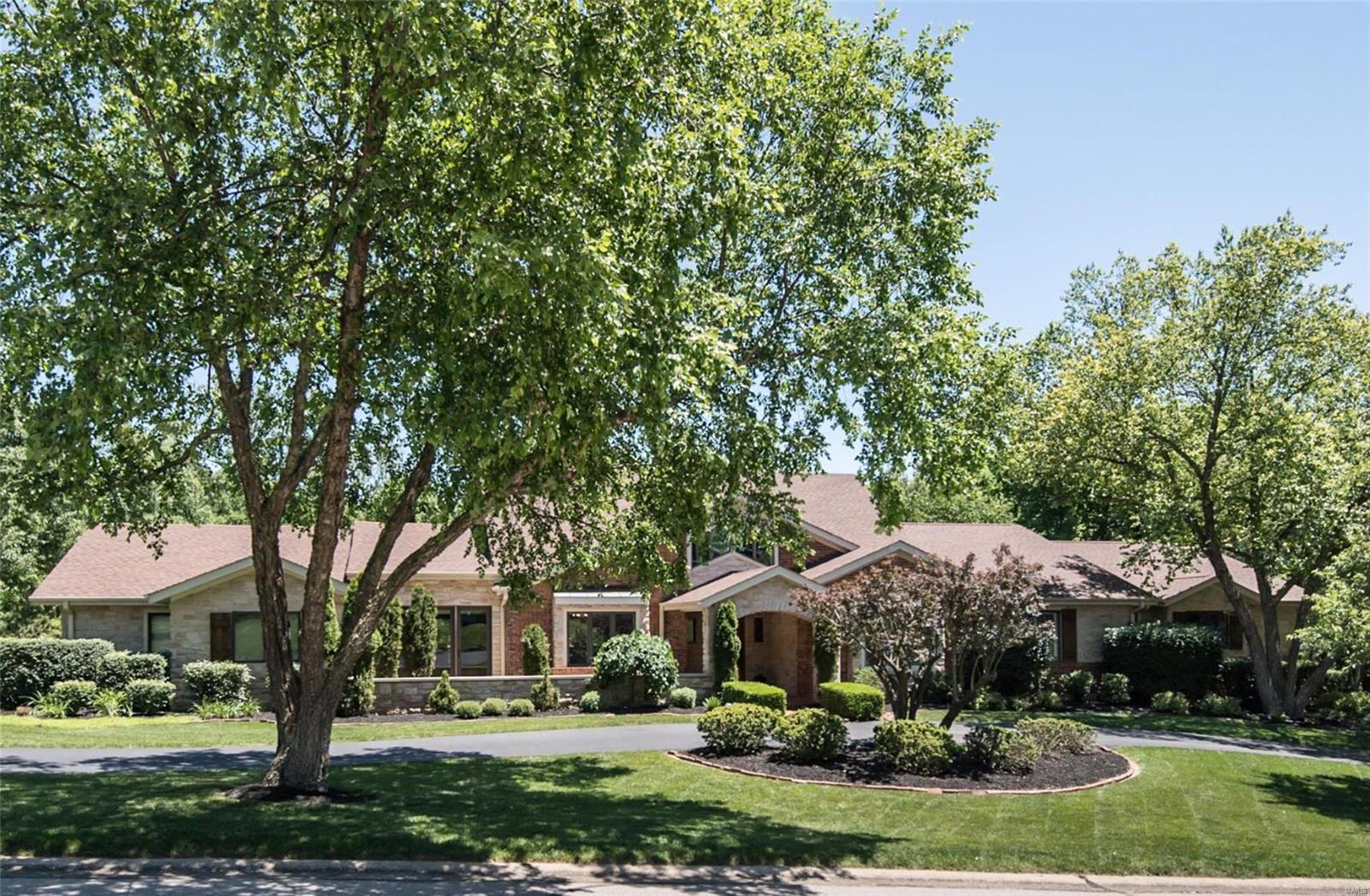 Spectacular brick & stone ranch home renovated & redesigned by Lewis Homes! Impressive travertine marble foyer highlighted by architectural columns leads to private study with wainscoting & custom built-ins & elegant dining room. Vaulted beamed ceilings, cast stone mantels & skylights add to the appeal of the stunning great room & step-down hearth room. Chef’s kitchen featuring glazed white cabinetry, granite countertops, commercial grade appliances & 2 center islands adjoins light-filled breakfast room with atrium door that walks out to terrace. Coffered sitting room opens to master bedroom suite with lavish marble bath with jetted tub, adjacent sitting room & 2 additional bedroom suites. Expansive Lower Level-ideal for entertaining-includes recreation room with brick fireplace, family room with entertainment center, gathering bar & solarium plus office, workout room & guest suite. Situated on a 1+ acre cul-de-sac lot with deck & patio surrounded by landscaped gardens with waterfall. Additional Rooms: Mud Room