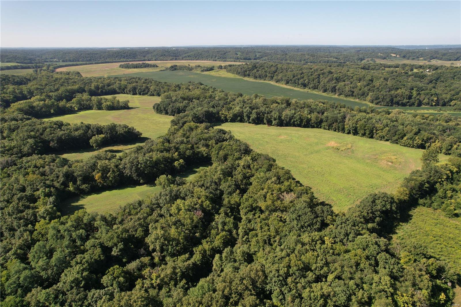 Located west of Kane, Illinois sits this 268+/- acre secluded paradise.  As you drive down the timber lined, gravel road, you will come to a dead-end and the gates to this phenomenal tract. Once you open the gates, you’ll drive onto the property and immediately start your vision of what touches you can put on this tract that hasn’t hit the market in over 70 years.  You will begin being captivated by the seclusion, rolling topography, timber make up and remote setting of this farm holds.  There are several trails that lead you throughout the established trail system this farm offers.  Each trail leads you past stand sites, water holes, established food plots and down to the bottom fields consisting of 61 +/- tillable acres.  This farm and area are known for producing some of the large Whitetail’s Illinois is historically known for.   In additional to the wildlife, with the Macoupin Creek’s tall banks, trapping, running a trot line or rod reel fishing will add to the fun this farm holds.