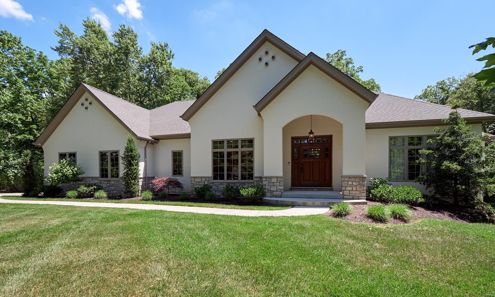 YOU WILL FEEL THE QUALITY CUSTOM FEATURES THE MINUTE YOU WALK IN THIS AMAZING THREE YEAR OLD ONE OF IT'S KIND PROPERTY! PERFECT WEBSTER GROVES LOCATION ON AN ACRE LOT! MICELI BUILT WITH BEAUTIFUL THOUGHT-OUT DETAILS! AMAZING TREE-LINED VIEWS EVERYWHERE YOU LOOK. WIDE-PLANKED NATURAL OAK FLOORS THROUGHOUT..ANDERSEN WINDOWS AND SLIDERS..HIGH CEILINGS, ARCHED OPENINGS, GORGEOUS KITCHEN INCLUDES KITCHEN AID APPLIANCES WITH 5-BURNER GAS COOKTOP, CUSTOM SOLID HICKORY CENTER ISLAND, QUARTZ TOPS, BACKSPLASH, STAINLESS FRIDGE..FLOOR TO CEILING STONE FIREPLACE, OVERSIZED BASEBOARDS, NUMEROUS TRANSOMS, SPACIOUS COVERED PATIO, MAIN FLOOR MASTER SUITE WITH WALL OF WINDOWS AND SPA BATH/HIS AND HERS CLOSETS..MAIN FLOOR OFFICE AND ADDITIONAL REAR OFFICE/MUSIC ROOM..THREE ADDITIONAL BEDROOMS, LARGE BONUS ROOM ON 2ND FLOOR..WALK-OUT LOWER LEVEL..HIGH EFFICIENCY HVAC..SPRINKLER SYSTEMS..THREE NEST THERMOSTATS..SMART SOUND/SECURITY SYSTEM..SIDE ENTRY 3-CAR GARAGE..WALK TO LARSON PARK!! HEART OF TOWN!