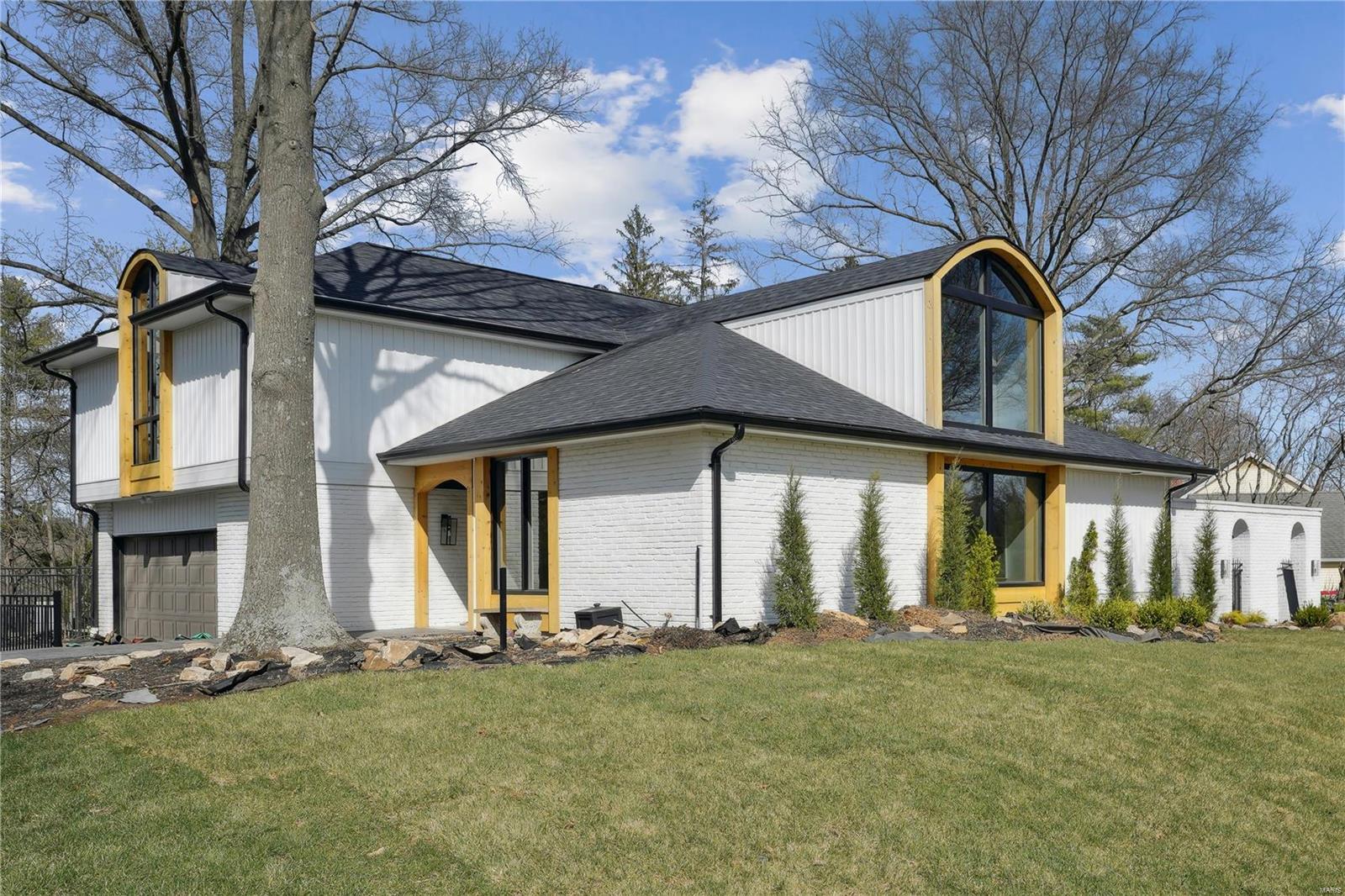 Welcome to this stunning 4-bedroom, 2.5-bathroom contemporary gem in the desirable Town and Country neighborhood! The bold windows fill the home w natural light, complementing the sleek, modern design. The sunken family rm flows seamlessly into the completely renovated kitchen, which boasts breathtaking views of one of the many inviting patios designed for entertaining. French doors in the family rm lead to a luxurious pool area, surrounded by expansive patios and charming walkways, perfect for hosting gatherings or enjoying peaceful outdoor moments. The open floor plan connects the living and dining rms, enhancing the sense of space and connection. Convenient main-floor laundry and a mudroom, along with a thoughtfully placed half-bath, make pool access and daily living effortless. The meticulous landscaping enhances the minimalist, chic aesthetic of this contemporary retreat. This home truly combines style, comfort, and functionality in a serene and sought-after location. Additional Rooms: Mud Room