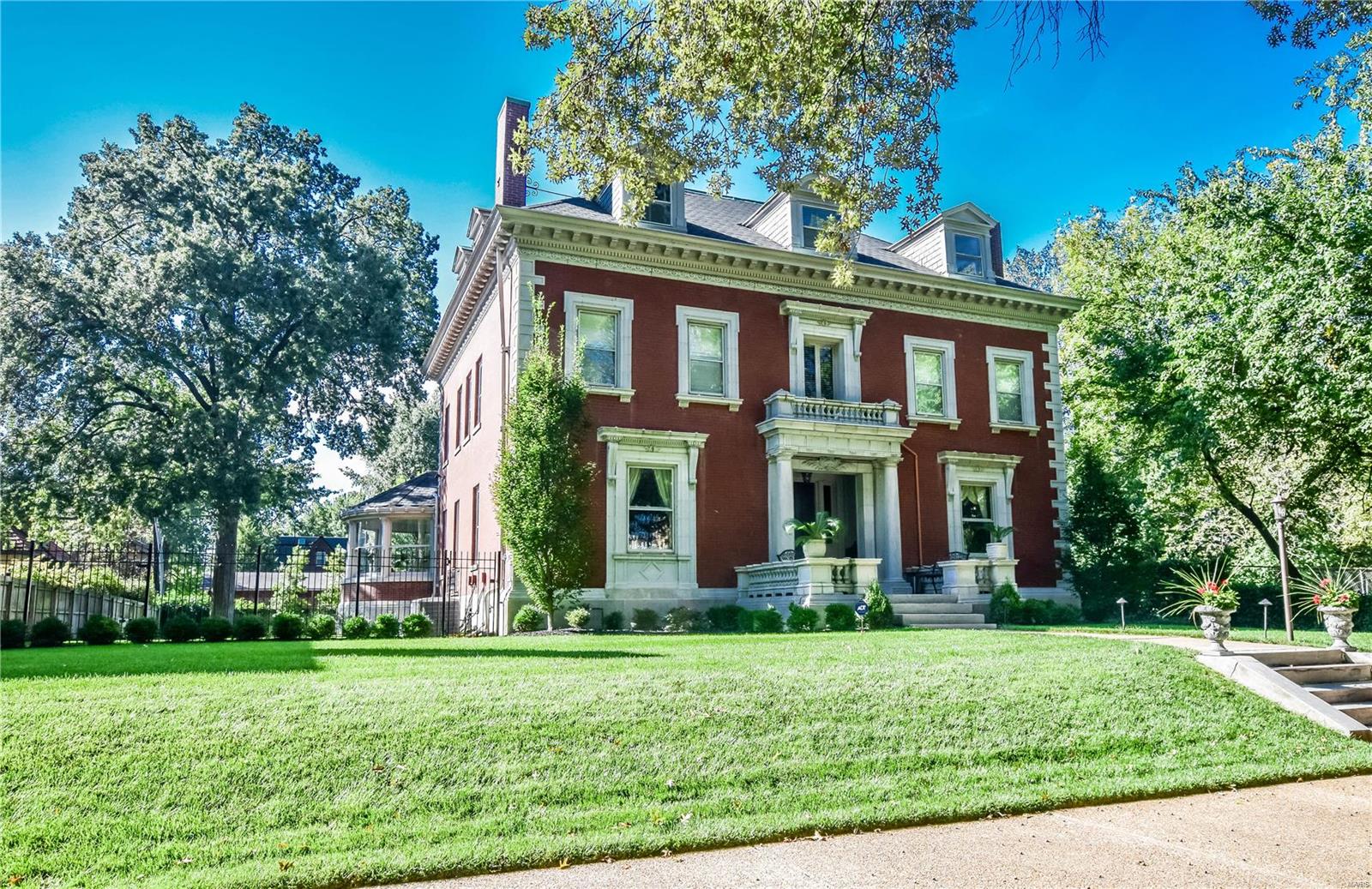 This Georgian Revival mansion is located on one of St. Louis’s finest private streets. Designed by Barnett-Haynes-Barnett, the 6000+ square-foot home is large but very livable, featuring 5 bedrooms and 4 ½ baths. The new Kitchen features a Wolf range, custom cabinets, quartz countertops, and an adjoining hearth room and a butler's pantry. The solarium rounded at one end and overlooking the pool might become your favorite room. The library is perfect for cocktails or reading. Master ste. features a large bathroom with two sinks/vanities, jetted tub, and separate shower. The second floor also features a sunroom, 2 more bedrooms, and 2 more full baths and laundry room. The third floor has 2 bedrooms, a full bath, trunk room and a large living area perfect for a family/TV room. New roof 2019, 2-car garage, gated driveway, new landscaping, irrigation system, all beautifully updated and maintained! Backs to Kingsbury Place. Walk to Forest Park, Central West End, WashU, BJC, and much more. Additional Rooms: Sun Room