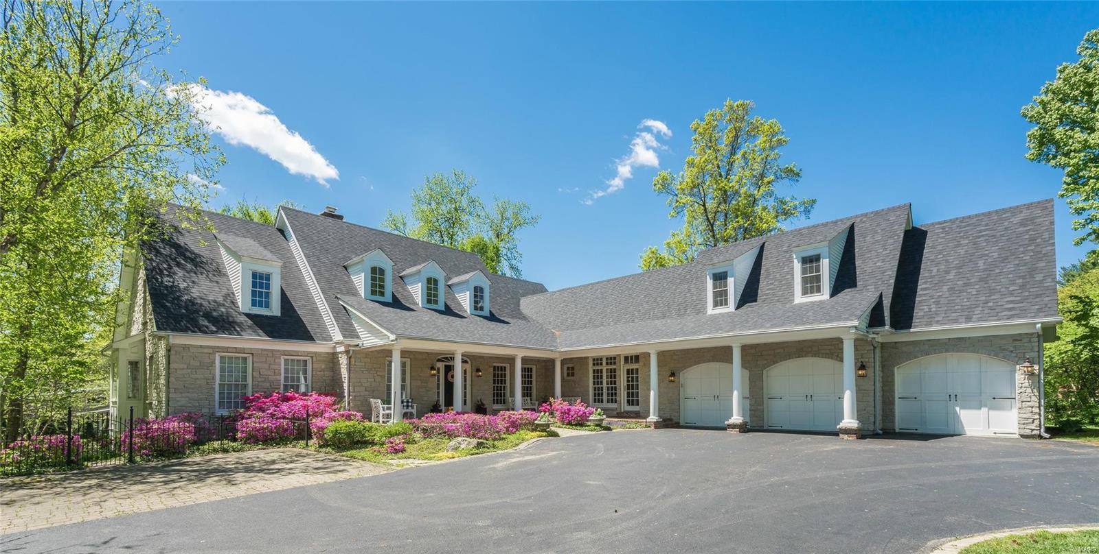 Custom Built Executive Home in sought after Kirkwood School District! 4+ Bedrooms, 4 Full Baths, two half baths, 3 car Garage & over 8000 sq ft of living space! This home has it all! Highlights: Beautiful Hardwood Floors throughout most of the home! Main Floor Master Suite with spa like Bath, Laundry & his/hers closets! Gourmet Kitchen w/stainless appliances, massive center island, butlers pantry & plenty of storage open to the Breakfast room & Great Room w/beautiful Stone, Gas fireplace. Completing the main floor is Formal Living w/Gas Fireplace, formal Dining, Mud Room, two half baths & Library w/steps leading up to private office space! Second floor offers 3 generous size bedrooms, 2 w/ Jack & Jill & one with full bath, laundry & storage! The lower level is partially finished w/Gas fireplace, huge rec space, craft rm or play rm, exercise rm & sleeping area plus unfinished area for storage! Gorgeous deck w/wood burning fireplace overlooking the private backyard! Free 4 year Warranty!