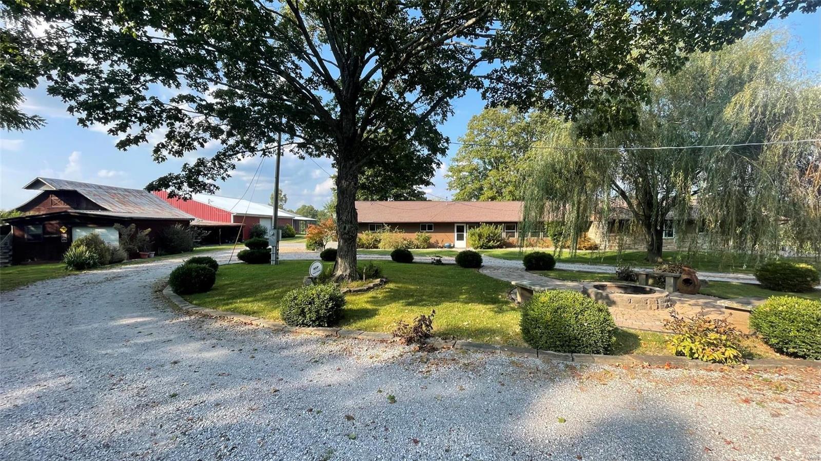 This is truly a Fantastic Southern Illinois Sportsman’s property!  This 236 acres has 5 lakes!  One beautiful lake approximately 16 acres!  This well-maintained property includes a 3 bedroom/ 3.5 bath home with very, nice deck and patio areas facing a 3.5 acre lake with covered pavilion.  Three large outbuildings, timber areas, 4 gravity fed containment ponds for waterfowl, and over 65 tillable acres (lime applied 2023). Whole house generator.