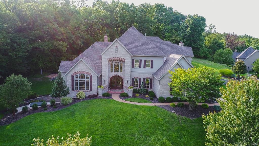 Spectacular 1.5sty, on 1.5 acres in Wills Trace! Fantastic floorplan w/4Bds; 5Bths (3F/2H) & nearly 6700 sqft of living spc w/LL. Incredible front doors, grand 2sty Entry, Study w/custom built-ins, formal Dining Rm & gorgeous Great Rm w/fireplace. Gourmet Kitchen w/custom cabinets, granite, breakfast bar, Wolf SS appliances, pantry, Breakfast Rm & Hearth Rm; Powder Rm & Laundry. Coffered Master Ste w/large bay, walk-in closet & luxury Bth w/Whirlpool tub & walk-in shower. 2nd Flr offers balcony/crosswalk, 3 Bds w/walk-in closets & 2 add’l Bths. W/O LL w/Rec Rm, walk-in wine cellar & tasting room, Powder Rm & Exercise Rm. Highlights: Hickory floors, Maple trim, solid wood doors, custom millwork, alarm, sprinklers, zoned HVAC, landscaped yard & side-entry garage. Relax outside & enjoy the private outdoor living spc w/custom designed patio, or relax in hot tub. Great location ~ convenient to shops, restaurants & parks. Easy access to hwys! Top Rated Rockwood Schools!