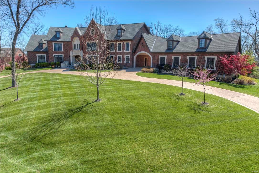 This home is situated on one of the most coveted streets in St. Charles County. Privately located in a 36 Hole Golf Community. Beautiful views from one of the Highest Points in the area, overlooking Chesterfield Valley, offering breath taking (360 degree) views from a Roof Top Observatory, irreplaceable!. Home is an all brick 1.5 story, with bedrooms and bathrooms galore, 11,000 square foot, & 3 acre lot. The sprawling flagstone patio, is surrounded by acres of mature oak and flowering timber. Architectural features, you would expect in a masterpiece like this, such as; a Sweeping Staircase, Lower Level Basketball Court and much more. Qualified Buyers must act quickly as this property won’t last long! Seller to offer a Home Warranty! Additional Rooms: Mud Room
