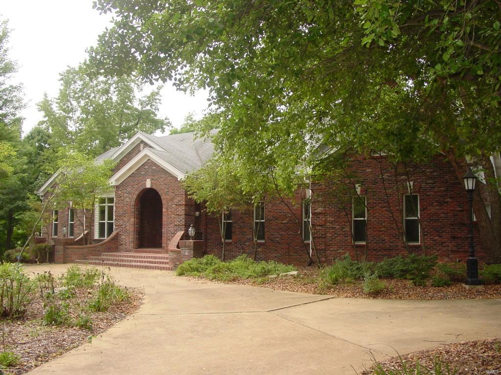 ** Located at the end of a quiet, private lane on a 3.4 acre estate nestled up to Queeny Park **
* Panoramic views of the wooded property and perennial gardens from many of the rooms in the house
* Secluded deck
* Quality, commercial grade construction
* Recently updated kitchen and baths
* Grand brick entrance
* Marble floored foyer
* Massive great room centered by floor-to-ceiling Royal Chateau stone fireplace
* Gorgeous kitchen boasting Crema Bordeaux granite, huge center island, and large walk-in pantry with 2nd refrigerator
* Walkout lower level 
* Giant Theater & Entertainment room pre-wired with THX Sound system
* Sports room
* Vault room with 12" thick steel reinforced concrete walls
* Extra bedrooms and office in lower level
 
** New Roof, new gutter & leaf guards Oct 2015
** $60k in recent improvements.

Seller is moving locally and would consider House Sale Contingency! Don't Hesitate!