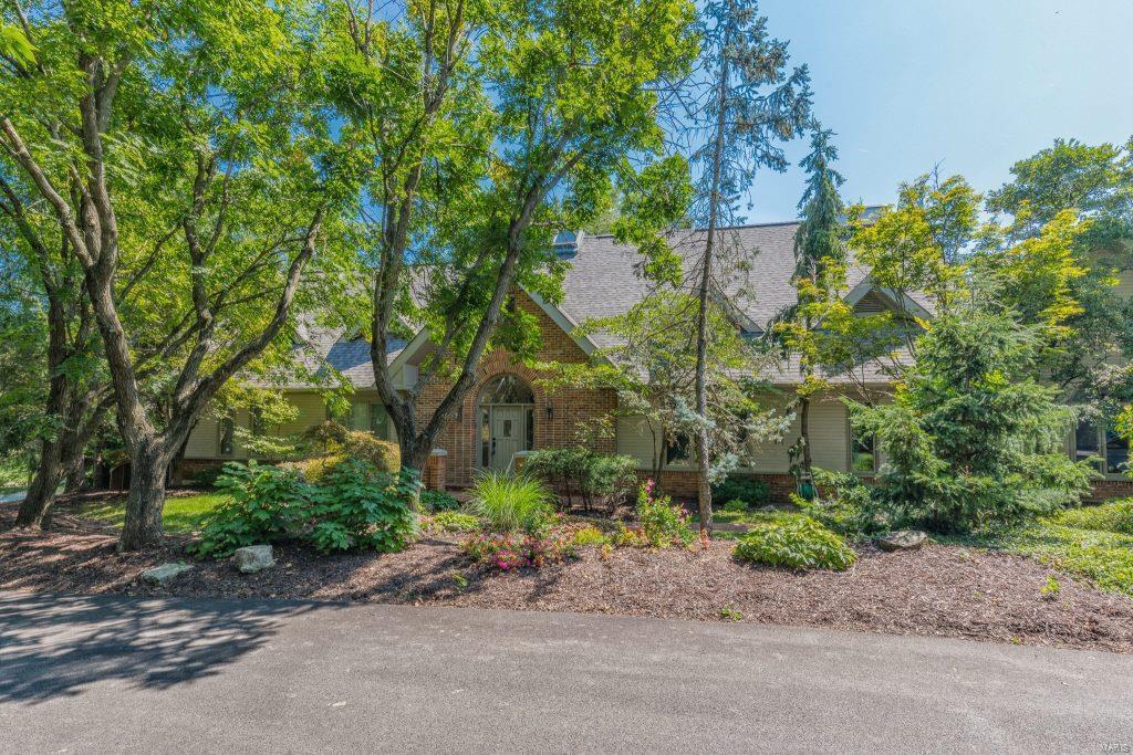 Stunning custom 1.5sty, on a private street in the Village of Westwood. Ladue Schools! 3Bds/5Baths (3F/2H) w/6600+sqft of living space w/LL. Entry Foyer w/20ft ceiling, gourmet Kitchen w/enormous breakfast bar, custom cabinets, granite, SS appliances, walk-in pantry, wine cellar, Breakfast Rm & Hearth Rm; Great Rm w/16ft gas fireplace w/colored fire glass & waterfall above. Master Ste w/frplc, coffee bar, walk-in closet & luxury Bth. Main Flr also finds Dining Rm, Study w/built-ins, Powder Rm & Laundry. 2nd Flr w/custom stairs & crosswalk w/2Bds & 2Bths. W/O LL w/Rec Rm, custom glass block bar & incredible Zen water garden & spa! Other highlights: O/S attached 2 car garage, zoned HVAC, alarm & sprinklers. Relax outside on the enormous deck w/outdoor Kitchen, cool off in in-ground pool, or admire lake views. Ultimate home for entertaining! Great location ~ near major hospitals, shops, restaurants, county parks & close to many private schools. Easy access to hwys!