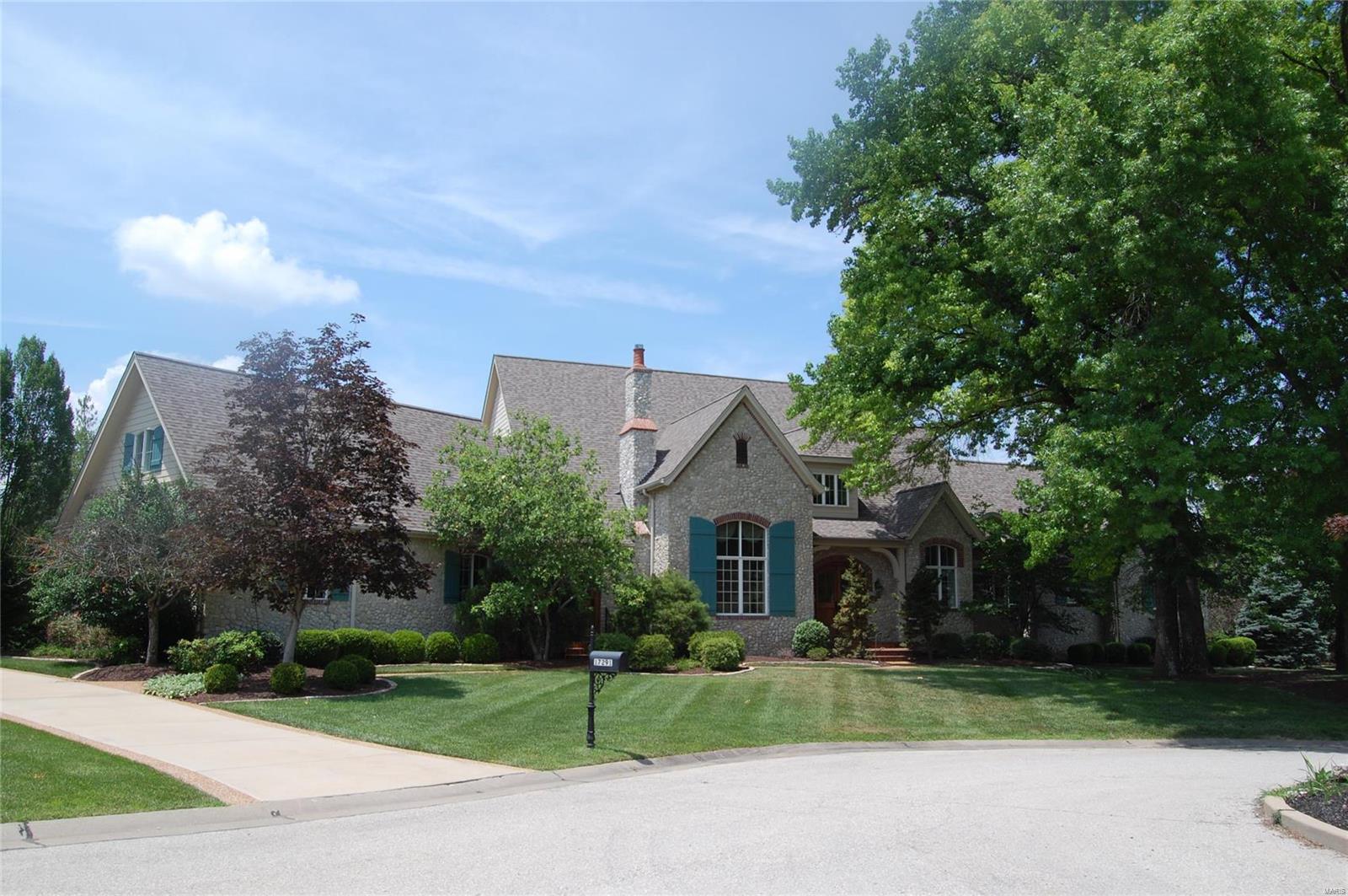 Make an offer! Nestled in a private cul-de-sac of only four executive residences, this French Normandy home is filled with fine design choices and true custom construction. The exterior is tumbled stone, a theme that carries throughout the home. The random width flooring is constructed in country themed knotty pine which has been recently refinished. Vaulted ceilings and open floor plan are elegant key notes. Chef kitchen boasts oversize island and breakfast room, opening to a beamed Hearth Room. Spacious living and dining rooms. Main level Master wing includes an office and provides abundant closet space filled in natural light. Three suites on second level. Walkout lower level has full wine cellar, billiard room, potential sleeping area, living room and gameroom. Outdoor entertainment is thoughtfully designed around the pool and spa, with outdoor kitchen and deck. New roof and HVAC. Make your personalized cosmetic changes to complete. Oversize three car garage.