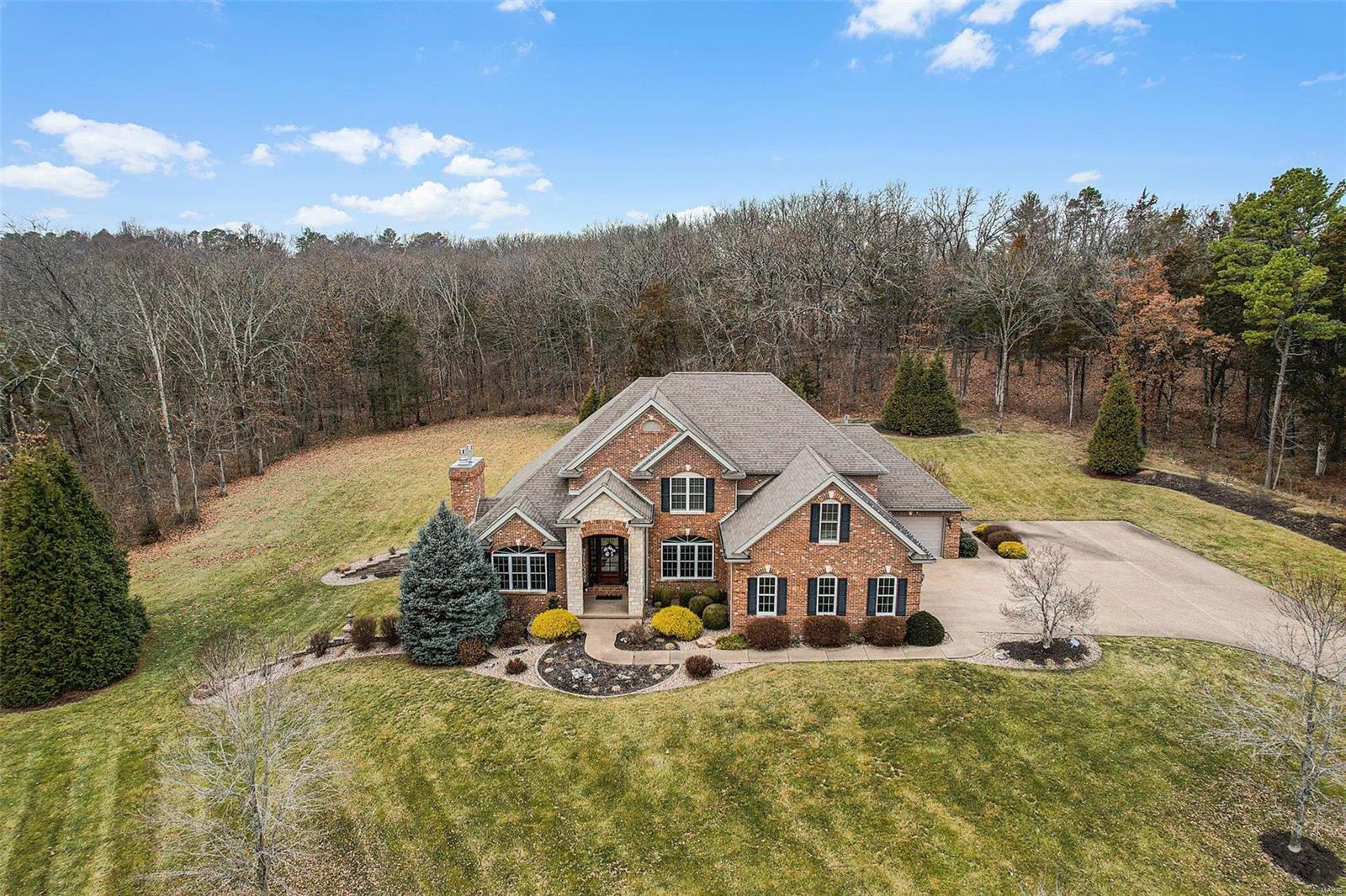 Unbelievable quality. Unbelievable space. Unbelievalbe setting. Believe it, it's available! This stately custom home is located just outside of city limits, sitting on 9.14 acres (more available upon request) & close to FCCC. Notable features: Full masonry, 2x6 construction, 4400 sqft, 4+beds, 4.5 baths, geothermal heating & cooling, recirculating pump on water heater, Anderson 200 & 400 series windows. 9'+ ceilings on main & upper floors, 10' pour in basement, upgraded trim package w/ 1-2 piece crown molding throughout. All trim, interior doors & staircases are solid wood. 3 fireplaces, extensive covered patio on main, 2nd patio in lower level. 3 car attached garage, heated & zero radius entry. Finished LL w/ kitchenette/bar, family room, rec room, large office (or sleeping area) along with expansive storage area. Mostly wood floors throughout with exception of bathrooms (which are tile). Grand 2-story entry foyer, 2 story living room, front/back staircase, extensive landscaping.