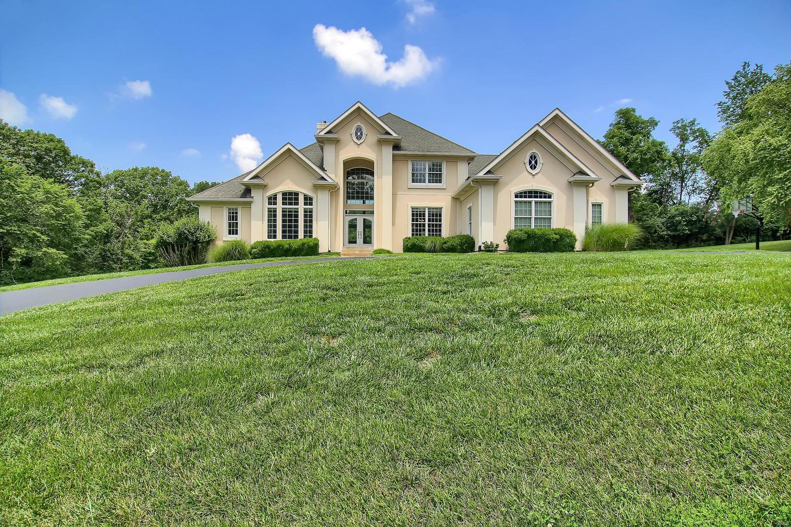 NOT ON MAIN ROAD-Take the Private Lane to an Awesome 3 ACRE SETTING!  Custom 1 1/2 Story Home with So Much to Offer! Elegant. Private Setting yet minutes to Suburbia. 2 Story Entry Opens to Spacious 2 Story Great Room with Fireplace & Lots of Windows for Natural Light.  Beautiful Kitchen is Open to Great Room & Breakfast Room & Vaulted Hearth Room-Perfect for Relaxing & For Entertaining! Breakfast Room Opens to Large Covered Outdoor Patio w/Fireplace-Perfect Outdoor Entertainment Space!  Main Floor Master Suite with Coffered Ceiling and Huge Luxury Bath with Double Walk in Closets. Upstairs features Loft Area overlooking Great Room + 3 more Bedrooms & 2 More Baths & Lots of Walk in Closets. HUGE Finished Lower Level with Recreation Room + Multiple Bonus Rooms & Full Bath.  Outside is great for entertaining  w/Large Covered Patio, Inground Pool and So Much Green Space for Play & Enjoying Nature. 3 Car Garage..NEW ROOF-FALL, 2019..Lots of Fresh Paint & New Carpet..Tasteful Decor & More!
