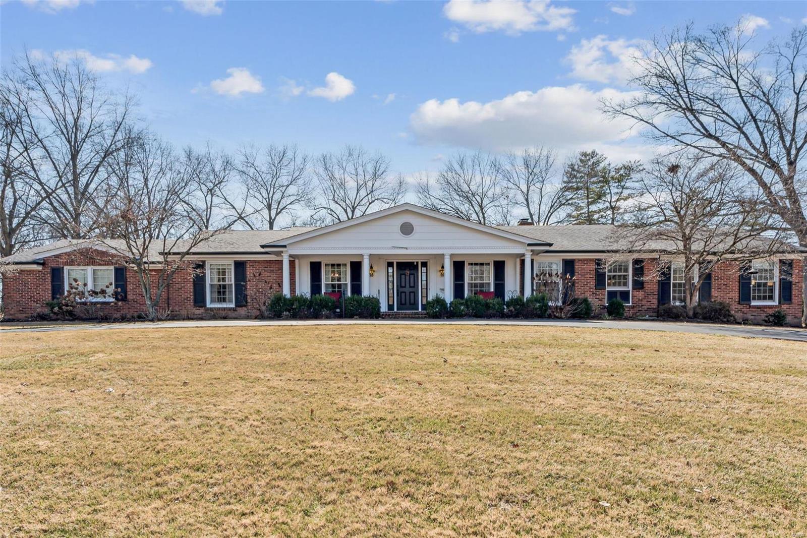 Welcome to 710 Timber Trail in Frontenac. This beautiful ranch home with nearly a 1 acre level lot is nestled on a cul-de-sac in the desirable Twin Fawns Estates. The gracious Entry Foyer opens to the formal Dining Room and adjacent Living Room. French doors from the Living Room open to the large Family Room featuring a gas fireplace, vaulted ceiling, and built in bookcase. The open floor plan is great for entertaining with the Kitchen opening to the Family Room and light filled Hearth Room featuring the 2nd fireplace. Enjoy time with family and friends in the spacious, screened porch with beautiful views of the back patios including the outdoor fireplace. The backyard is truly an oasis!  Easy main level living with the Master suite, 3 additional bedrooms and a total of 3 updated baths. Additional features: circle drive with side entry garage, inground sprinkler system, outdoor fireplace and pizza oven, beautiful millwork, hardwood flooring, main floor laundry and lower-level rec room.