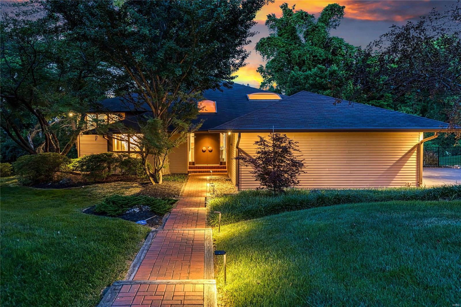 Sophisticated Contemporary in prestigious Bryn Wyck. Multi-level floor plan features oak hardwoods, soaring ceilings & expansive windows that draw in an abundance of natural light. Impressive marble foyer leads to vaulted study, step-down great room with 17’ ceiling, wet bar & granite fireplace, living room with built-in display case and formal dining room that opens to patio. Chef’s kitchen with granite countertops, DKI custom cabinetry, premium appliances & 12’ center island adjoins light-filled breakfast room. 2 Generous-sized bedrooms & hall full bath complete the main floor living quarters. Front & rear staircases access primary bedroom suite with 2 walk-in closets, luxury bath with Bain Ultra tub & private balcony plus 3 additional bedrooms, 1 with ensuite bath, bonus room & hall full bath. Lower Level includes family room, recreation room with wet bar, game room, office & full bath. Situated on a .85-acre lot with composite deck, patio with gazebo, hot tub & pool with waterfall.