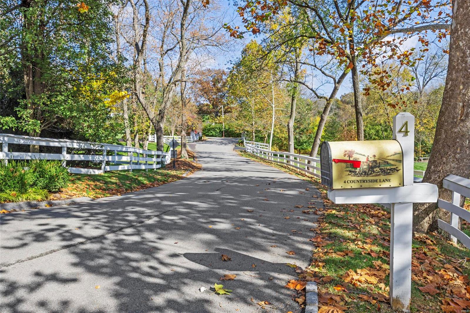 Ideally situated on a premier lane in one of Frontenac's most prestigious neighborhoods, this elegant and classic 6 bedroom 4 full & 3 half bath home offers timeless beauty in a park-like setting. The spacious and light interior features a welcoming entry hall flanked by an elegant dining room, living room with a cozy fireplace, paneled study, and family room with a stone fireplace that opens out to a remarkable outdoor space with a large deck, brick patio, pool, and beautiful gardens creating the perfect space for entertaining family and friends. Tasteful updates include an eat-in kitchen with custom cabinetry, granite countertops, stainless appliances, gleaming hardwood floors, adjoining wet bar, and laundry room. The 2nd floor includes 5 bedrooms including a spacious master suite and 3 full baths with heated floors. Lower level with family room, recreation room, fireplace , fitness room,  1 bedroom and 1.5 bathrooms. Outstanding home, superb location.