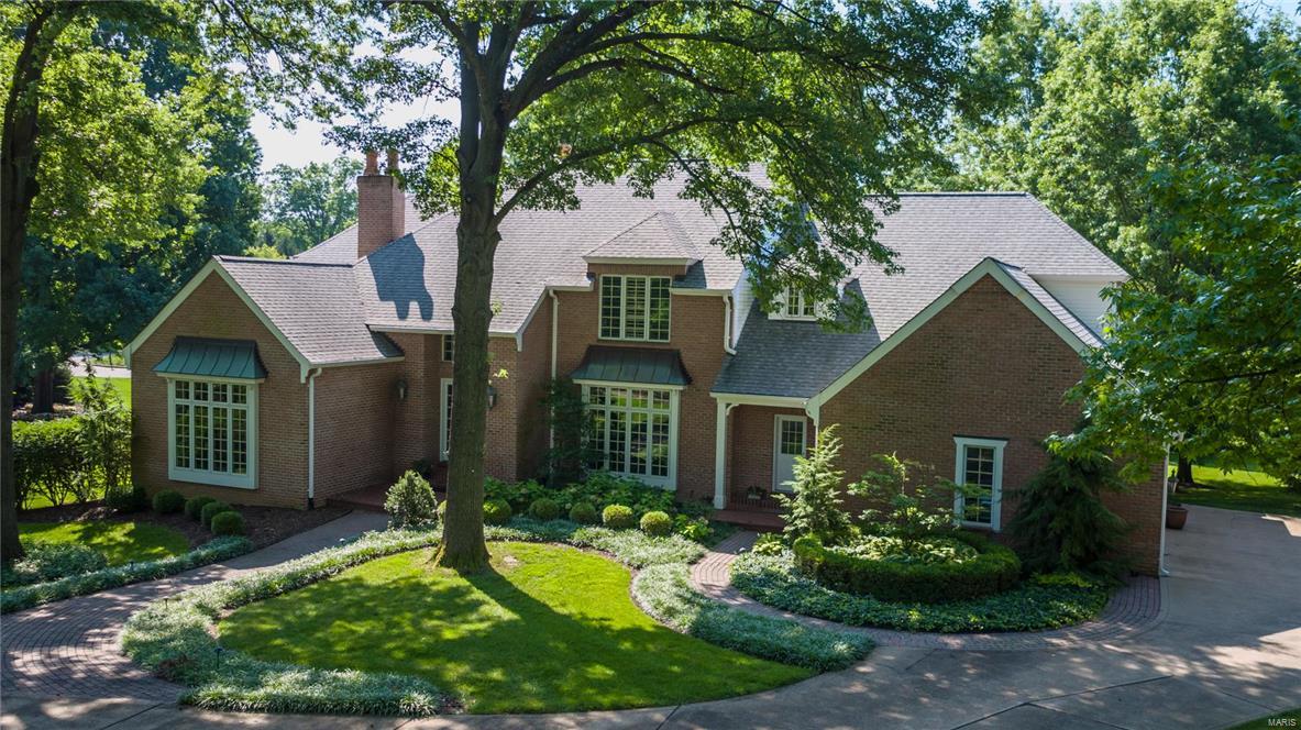 Magnificent executive home located in the premier Frontenac neighborhood of Ballantrae. This home sits on a lovely 1.23 level, acre lot & features 6,108 sq. feet of living space. Large foyer with a grand staircase. Formal Dining Room & Living Room with fireplace & bay window. The 2-story family room has a fireplace, wet bar & French doors that leads to a large deck. The kitchen features granite counters, plenty of cabinets, new double ovens, gas range, walk-in pantry & a bright breakfast room. The main floor master suite has a study/library with fireplace, large bedroom, fireplace & a bay window. The master bathroom features marble tile, dual vanities, Jacuzzi tub & separate shower. Walk-in closet. The 2nd floor has 3 bedrooms with en-suite bathrooms. The Lower Level has a full walk-out with an expanse of windows & doors that lead to a patio, custom millwork, fireplace, tall ceilings, bath, kitchenette & an unfinished area ideal for an extra bedroom. Main floor laundry. 3-car garage.