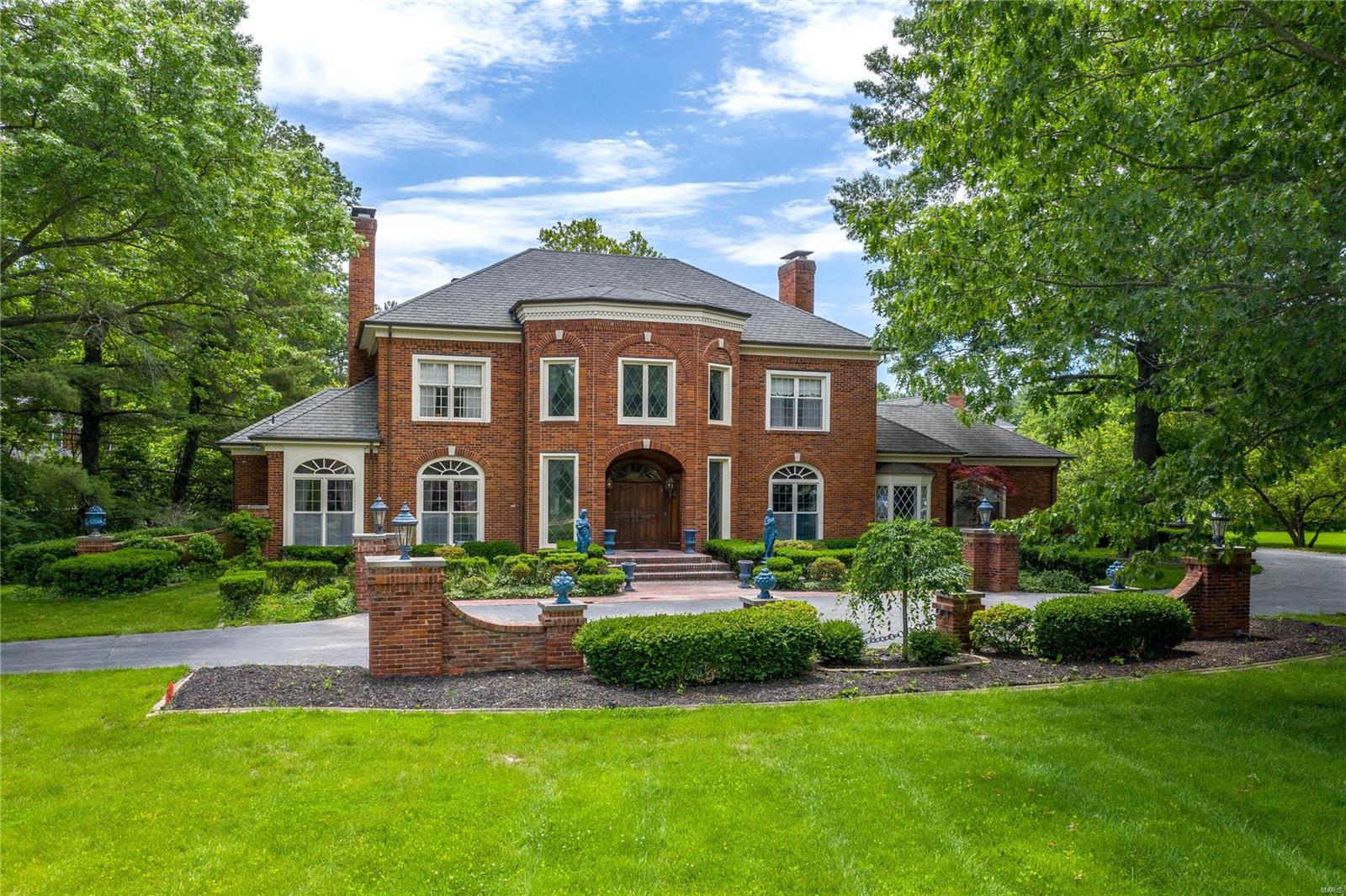 Exquisite Higginbotham-built brick 2 Sty distinguished by superior craftsmanship & distinctive architectural elements throughout including gleaming wood floors, extensive molding, custom built-ins & elaborate millwork that graces each entryway. Grand 2-sty marble foyer with dramatic curved staircase & gallery landing opens to elegant living & dining rooms, private study with built-in bookcase & library-paneled family room with wet bar, spectacular fireplace with floor-to-ceiling hard carved mantel & atrium doors that open to terrace. Chef’s kitchen featuring granite countertops, custom cabinetry, commercial grade appliances & convenient planning center adjoins breakfast room with wide bay window.  Elevator access to 2nd floor living quarters with sumptuous master bedroom  suite with marble fireplace, His & Hers walk-in closets & luxury bath plus 2 additional bedrooms & Jack n’ Jill bath.  Situated on a 1+-acre lot with pool, pool house & brick terrace surrounded by landscaped gardens.