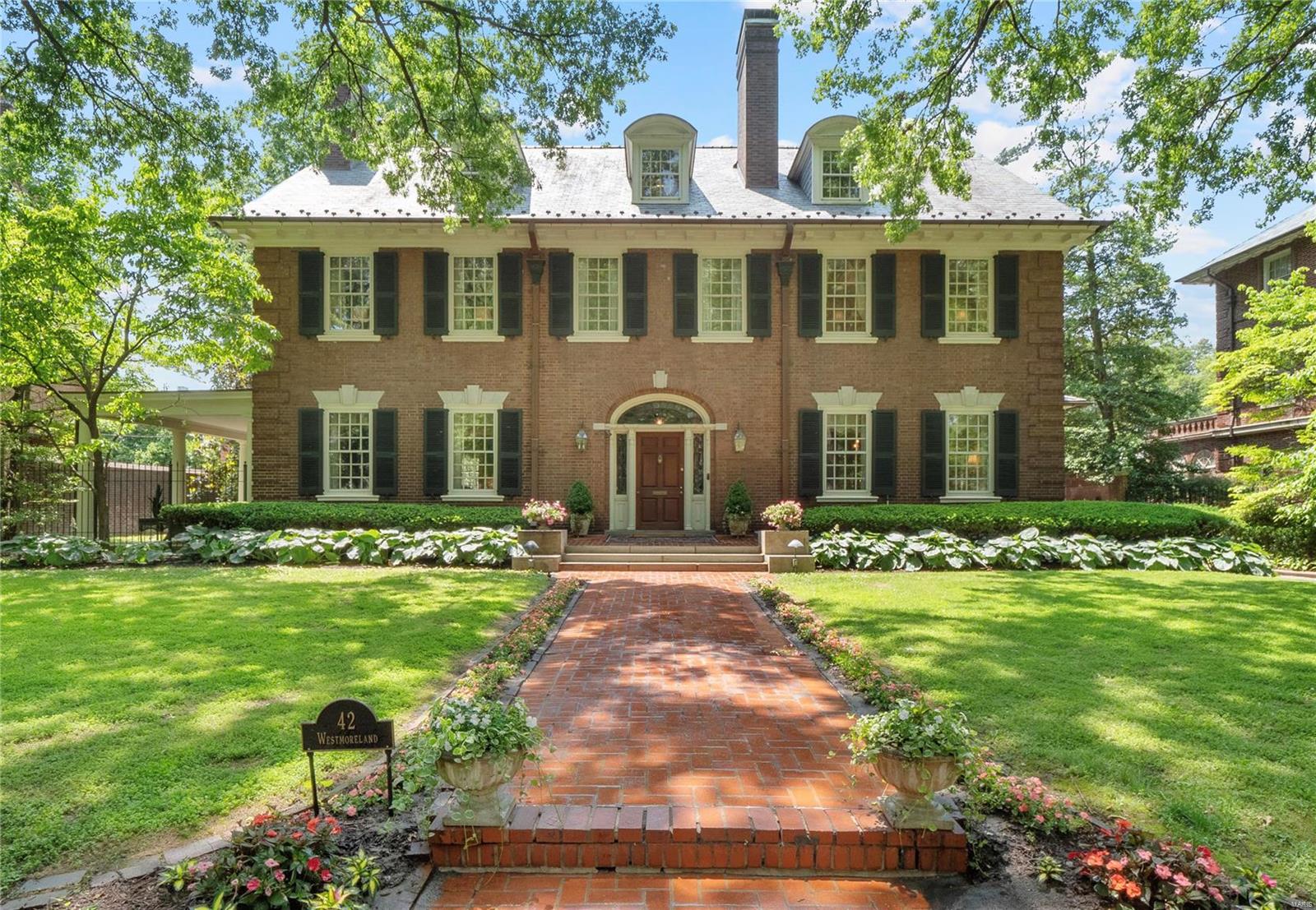 This 6056 sf Georgian Revival offers the perfect balance of spaciousness and manageability. Nestled among the stately mansions of Westmoreland and Portland Places, #42 offers the opportunity to live in the prestigious, historically significant neighborhood without committing to the care and maintenance of a large mansion. Designed in 1906 by James Jamieson, renown collegiate architect, for his beloved daughter. Six bedrooms (or 8 when including the two large bonus rooms), 5 1/2 baths,  detached, oversized 2 car garage w/attic space that can be finished, multiple outdoor living areas and a beautiful back yard with heated pool. Gorgeous leaded glass doors in the charming vestibule lead to the expansive 2 story foyer. Rich paneled wood walls in the grand living room. Dining room adorned with Scalamandre fabric and an exquisite chandelier. A multi-use butler's pantry and modern kitchen with custom inset cabinets, premium appliances, and bay window overlooking the pool. Showings start 6/2.
