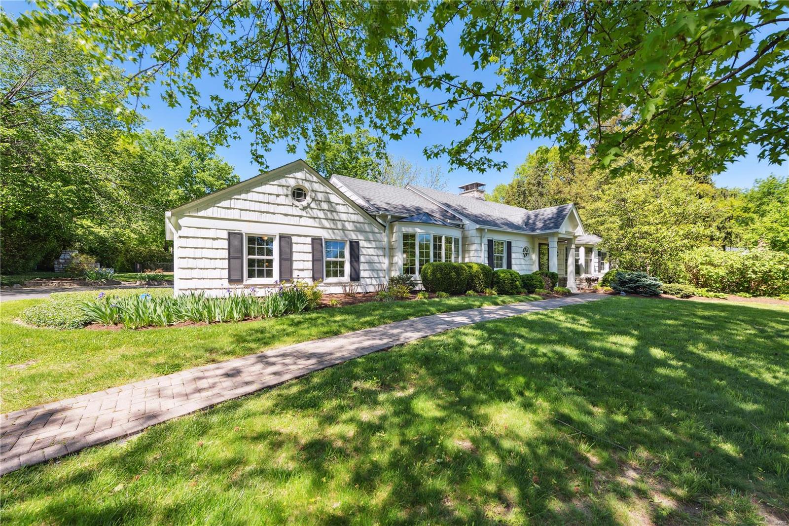 This charming Cape Cod ranch exudes understated elegance with its spacious interior from front to back. This home is a gem. Featuring two Mitchell Wall additions, including a sun-drenched family room complete with a wall of built-in bookshelves, The spacious primary bedroom boasts a large walk-in closet and a lovely primary bathroom, Gleaming wood floors, elegant moldings, and arched doorways adorn this home throughout, creating a warm and inviting atmosphere. The eat-in kitchen is well dignified with custom cabinets, double ovens, gas cooktop and solid surface countertops. Other features include a formal living room, formal dining room, cozy den/office and two generously sized bedrooms. Convenient main floor laundry room. The lower level offers ample finished/unfinished space for additional living or storage space. Lets not forget the discreetly tucked away Pool in the backyard. A true oasis for those warm summer months.