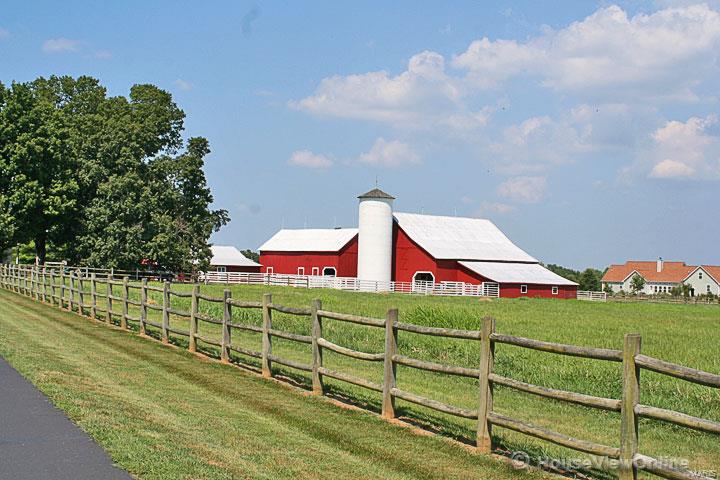 What an AMAZING opportunity!! HORSE LOVERS dream!!!  Fantastic, completely remodeled 111 year old farmhouse. This exclusive home sits on 21.5 beautiful acres m/l just outside Farmington and features 4+ bedrooms & 5 baths.   The entire home has been remodeled from the kitchen & baths to the stunning family room, to the wrap around porch to the attached garage with studio apartment above garage. Newer roof and windows. Home also features Two 2-Car garages, 3 functioning barns & silo.  Don't miss the guest quarters above the attached 2-car garage. OUTSIDE THE CITY LIMITS!