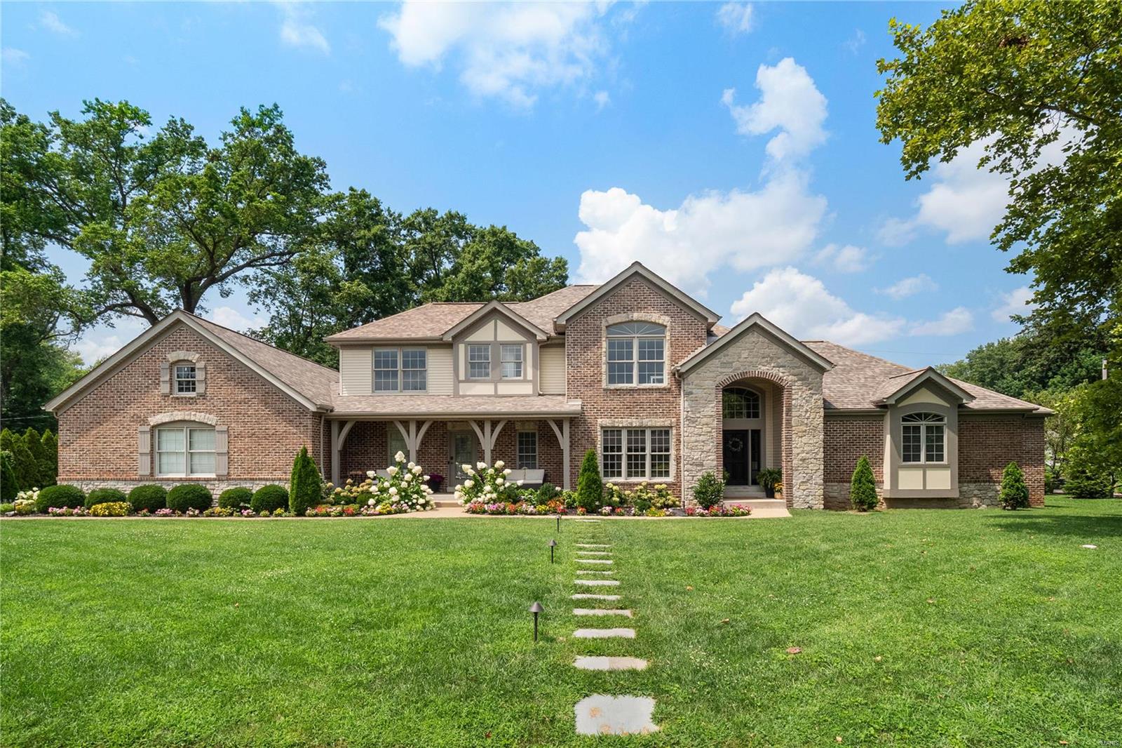 Wow! Pride of ownership is evident the moment you pull up!  Don't sleep on this 1.5 story home in the Ladue School District! Spacious primary suite on 1st floor w/ 2 cust. walk in closets, 2 granite vanities, sep. tiled shower, jet tub & private water closet. Tons of space for gathering on 1st floor w/ newly refinished wood floors (2023). Sep. DR & LR w/ amazing windows, 2 sided fireplace shared w/ hearth room & updated kitchen w/island, brkft bar w/seating up to 6, in addition to eat-in area. Split staircase to 2nd floor services hearth room and front entry. 2 half baths & updated laundry/mudroom finish off the main level w/2 W/Ds that stay with the home! Large 3 car side entry garage has all the space for cars & storage needs and outlet for electric vehicle. The 2nd floor has loft area & 3 add'l bedrms and 2 full baths. But wait.. the lower level will blow your mind! Engineered wood floors, mini kitchen/wet bar, media area, home gym, office & 5th bedroom & full bath! Move in Ready!