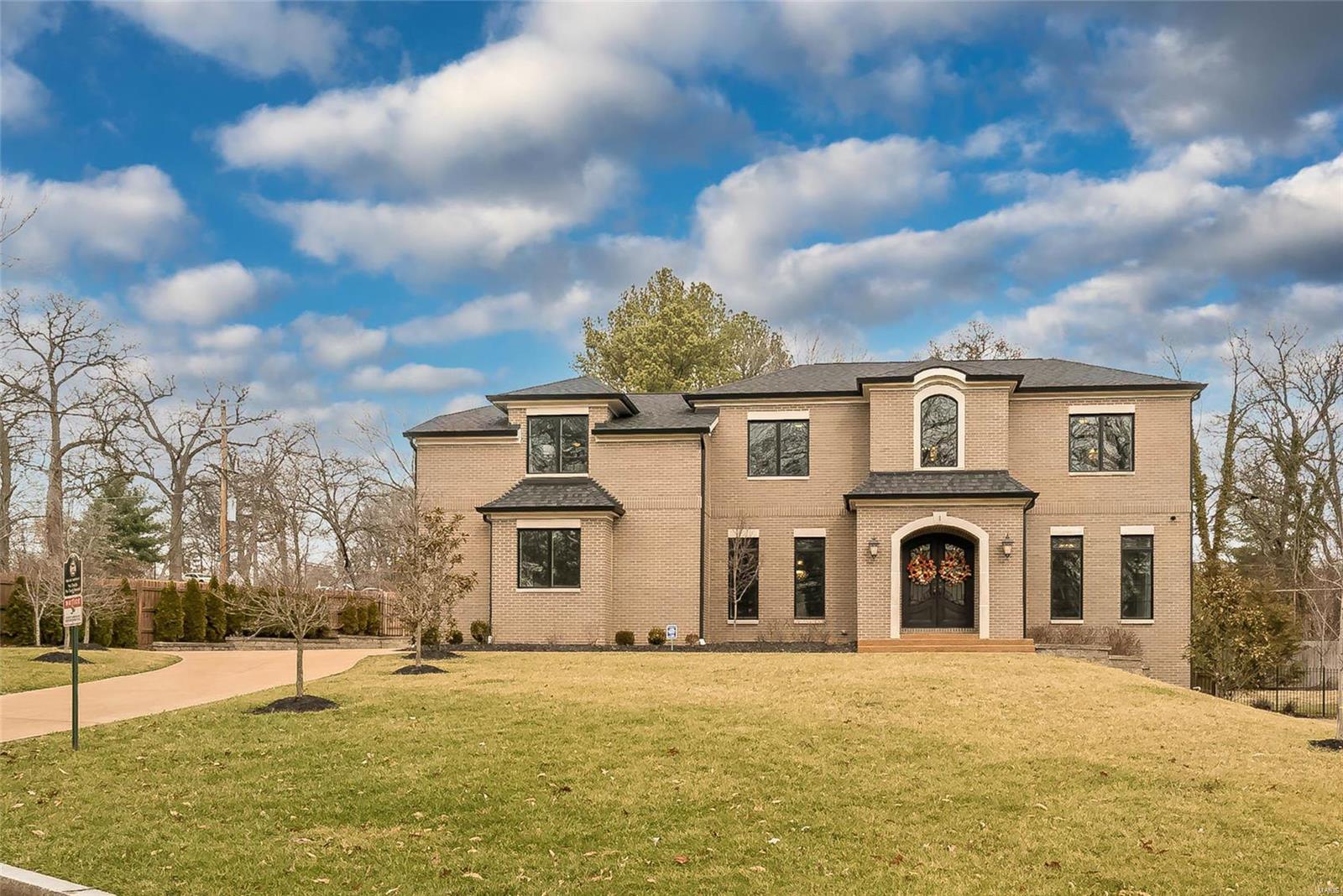 Amazing opportunity for the lucky Clayton Luxury buyer. This impressive home is designed by Lauren Strutman & built with state of the art luxury appointments on large lot in Clayton with neighborhood park overlooking Oak Knoll Park. Soaring ceilings, open floor plan, custom wood work & designer lighting is found throughout the home. Grand entrance greets guests & flows into private office and sun drenched dining room. Expansive Great Room adjoins Gourmet Kitchen & Breakfast Nook to outdoor patio 
Kitchen features top of the line appliances, cabinetry & counter tops. Well organized 1st flr laundry and locker areas. Highly desired main floor master bedroom suite is grand with soaring coffered ceilings, luxurious spa like bath & oversized closet. 2nd floor features 3 large en-suite bedrooms and grand loft/living area. LL is entertaining dream with theater, workout room, 5th bedroom, full bath & custom bar. Oversized 3 car ground level garage & level fenced yard. Exceptional construction. Additional Rooms: Mud Room