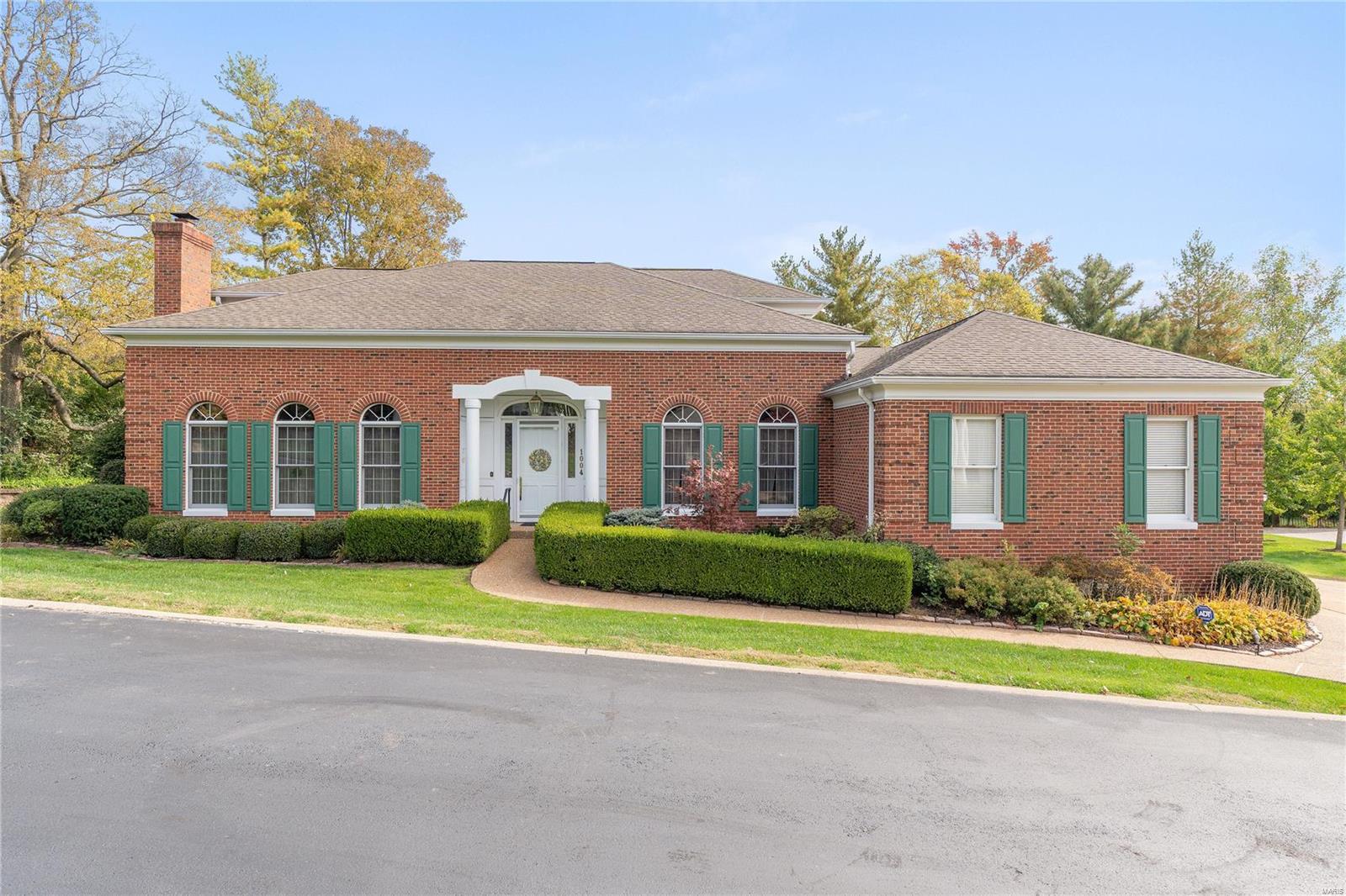 Rare find! Elegant, Ladue-adjacent residence tucked away in the charming, exclusive, and highly sought after enclave of Bramley Lane offers villa-like ease of living with a sense of community. Imagine entering your new home via a grand, marble-tiled foyer with 20+ foot ceilings, and enjoying a carefree lifestyle on a main level that boasts a richly-appointed dining room with exquisite crystal chandelier, club-like office/den with custom cherry paneling, light-filled family room with wet bar, casual and welcoming kitchen, and spacious main floor primary suite with huge bathroom. Up the foyer's grand staircase are 2 bedrooms and 2 baths, while a walk-out lower level offers another ensuite bedroom, finished spaces for play or entertaining, and loads of storage. This wonderful property also features a 3 car garage, large Ipe wood deck, mature landscaping, and new heat, AC, and hot water heater (2023). This one won't last!
