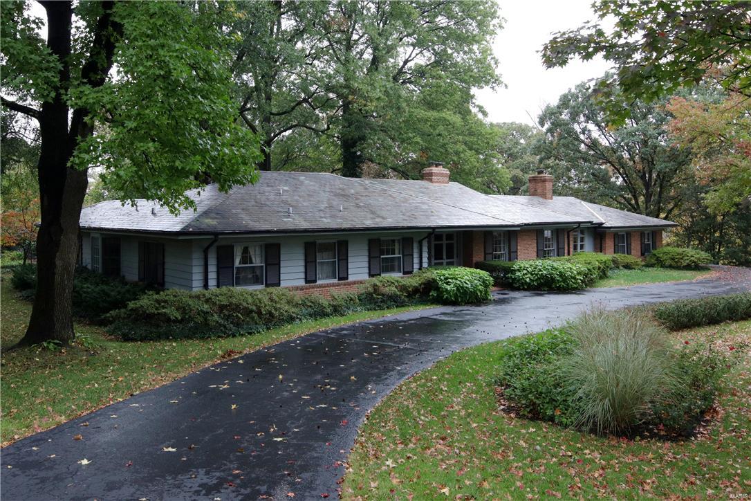 Exceptional opportunity in Ladue to renovate this "as-is" property or build on a simply stunning lot overlooking the 11th tee box of Old Warson Country Club golf course. Three bed, 4 bath home has a gracious floorplan, beautiful millwork and one of the loveliest lots on Trent Drive! The home boasts an updated kitchen and a welcoming Higginbotham-built master suite addition. The large living room has floor to ceiling windows, a family room with vaulted ceiling and a club-like library nearby.The updated kitchen features custom cabinetry, a granite-topped center island and an adjoining breakfast room overlooking the patio and opening to a stunning screened porch with vaulted wood ceiling. The newer, Higginbotham-built master suite is bright and welcoming, with updated bathroom and large, well-appointed walk-in closet. The 2-plus acre grounds are nothing short of stunning, with a picturesque pool, charming fountain and lovely views in every direction.
