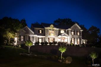 Welcome to this dream home nestled high off street for breathtaking panoramic views. You will be captivated by this remarkable setting. First floor boasts 2 story grand entry flanked by sophisticated dining room and living room that leads to an oversized den with wall of windows. The kitchen is the heart of the home, outstanding and functional with custom cabinets, granite counters, top of the line appliances. Exceptional hearth room with custom builtin beverage bar, fireplace and hardwood floors.Open the doors to a backyard that features an enviable entertainment/cooking area/outdoor fireplace and outstanding salt water pool.Magnificent views!!!The home has a seamless open flow that is richly appointed throughout. Luxurious Master Suite, deep pour LL, oversized 3 car garage, professionally landscaped and lighting. Floor plan allows for family and friends to enjoy privacy and togetherness.  Don't miss this one.