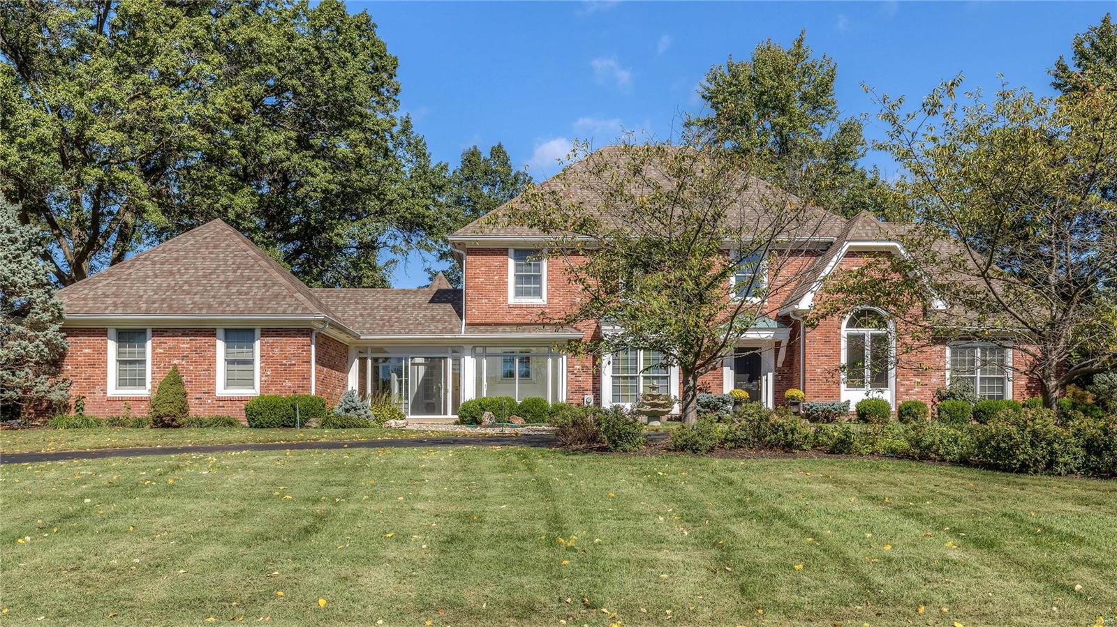 Fabulous brick 1.5 Sty on 1+ acre! Custom-built home distinguished by exceptional quality & craftsmanship throughout! Gracious 2-sty foyer w/framed entryways to paneled library w/built-in bookcases, formal dining room w/extensive millwork & spectacular 2-sty great room w/beamed ceiling, floor-to-ceiling brick fireplace flanked by Palladian windows, wet bar & French doors that open to sunroom. Gourmet kitchen w/cherry cabinetry, granite countertops, center island w/breakfast bar & planning center adjoins octagonal breakfast room w/wall of windows & sunroom that overlooks park like backyard. Main floor MBR w/coffered ceiling, huge walk-in closet & luxury bath w/His & Hers vanities & Jacuzzi offers a private retreat. 3 additional BR's, 1 w/private bath & 2 w/Jack n' Jill bath, + bonus loft area comprise the 2nd flr living quarters. Open staircase to professionally finished LL w/spacious rec room w/wet bar, 5th BR/office & bath. Private cul-de-sac lot with circular drive, patio. Additional Rooms: Mud Room, Sun Room