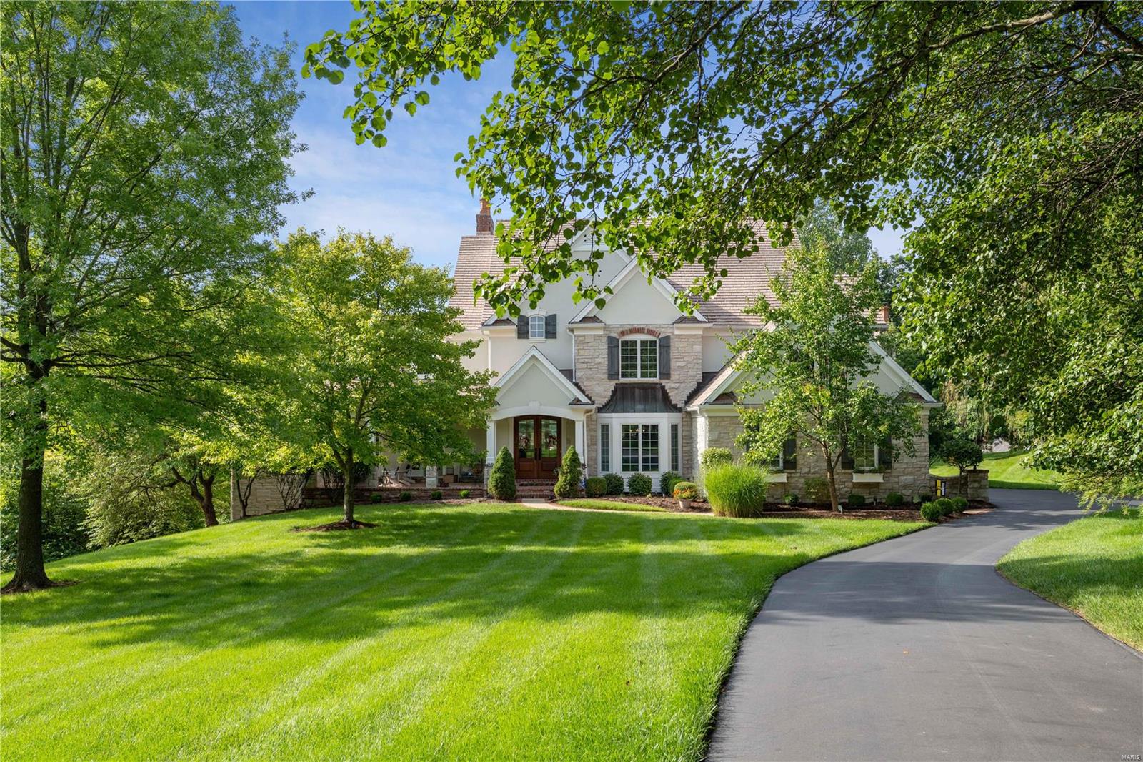 Seller has job opportunity and moving move out of state after short time living in this amazing home. Improvements since their purchase: All carpet replaced in the home, including stairs & stair runner, Blackout window shades, new chandelier in hearth rm & many light fixtures thruout home are new, new floor in exercise room, new paint in many rooms, water filtration system, security cameras, video doorbell, smart lock, upgraded whole house stereo WIFI system, new window treatment in great rm. This home does hold the distinction of being built on the first homesite purchased on Morel Court due to its spectacular golf course view of the 15th green on the Lewis & Clark Golf Course.This 1.43 acre homesite offers vast possibilities for a future pool. The home has a newer remodeled primary bath & kitchen w/ Wolf & Subzero Appliances. Garage has built in storage features & Tesla car charging station. Seller will negotiate selling new furniture purchased for the home outside of sale of home.